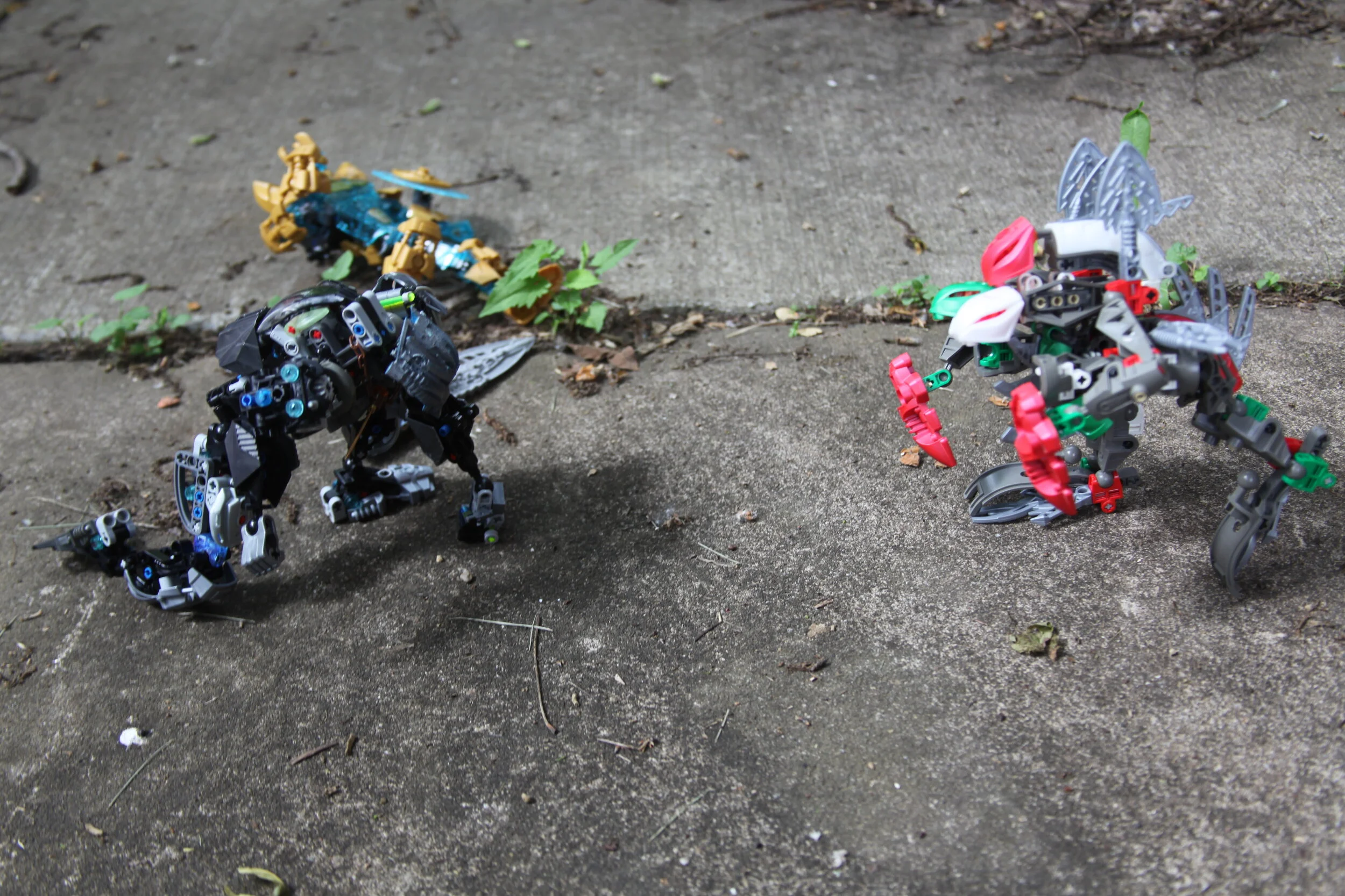  (The Kaita za  lumbers slowly toward the now immobile ‘toa’, Ekimu begins to stir) 