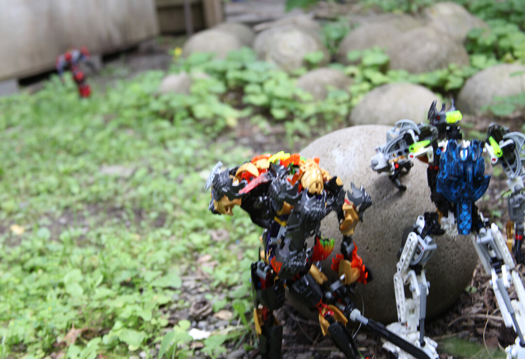 (nearby the two titans eyed the mysterious newcomer with unease)