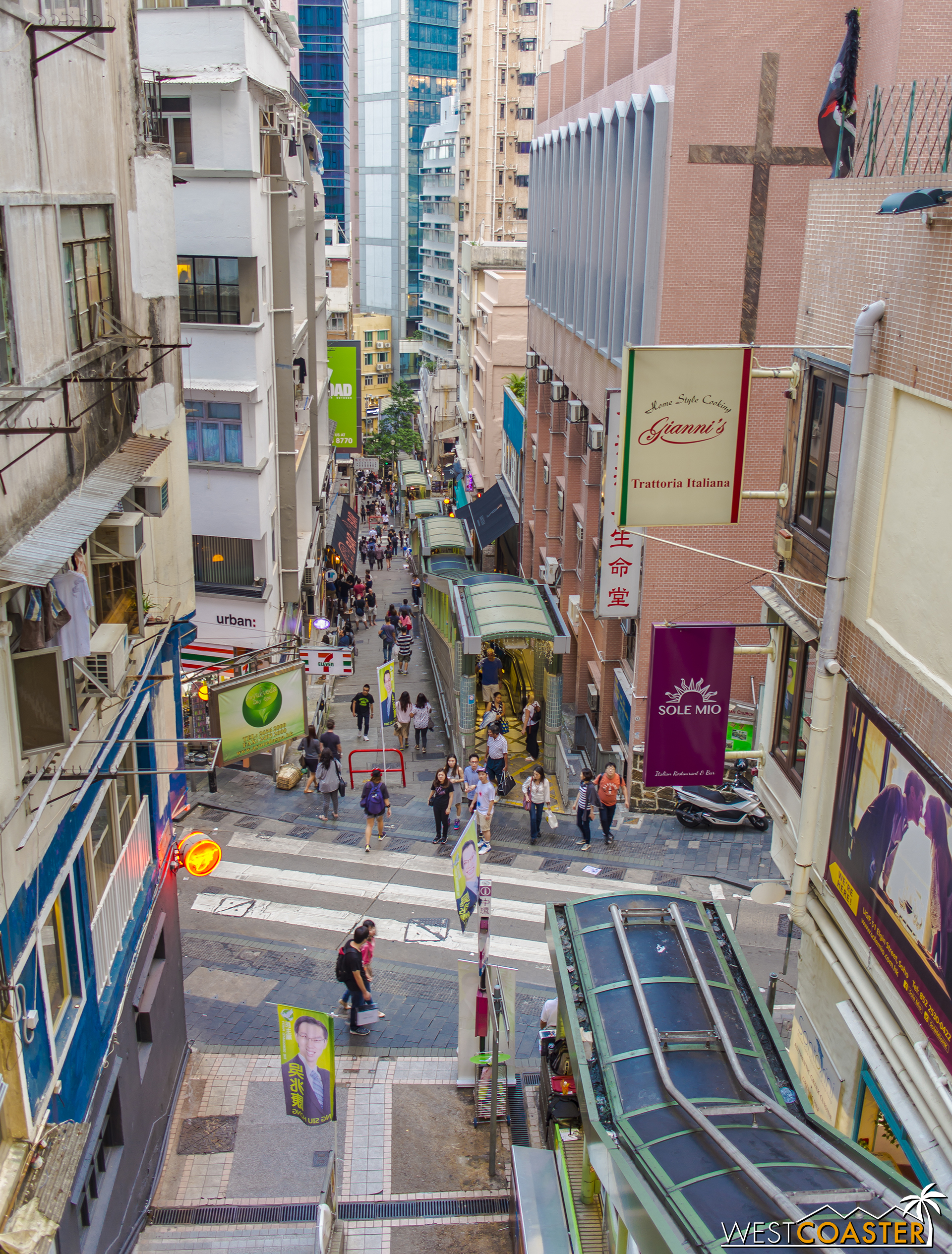 The Central-Mid Levels Escalator and Walkway System is the world's longest covered outdoor escalator system in the world and connects the multiple tiers of geology in urban Hong Kong. It spans nearly half a mile and takes pedestrians up a vertical elevation gain of nearly 450 feet.