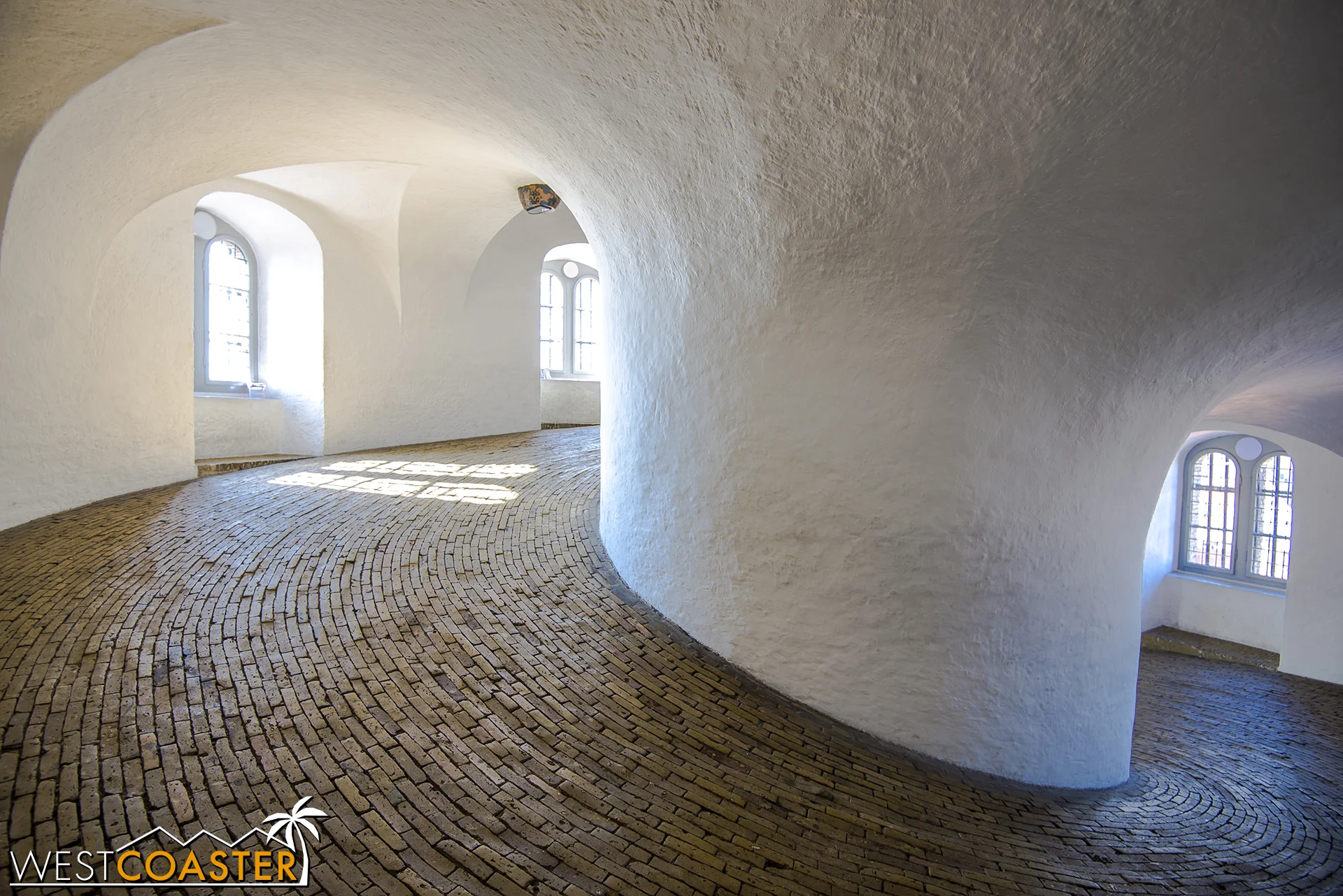 The Round Tower, located in the center of the city within the University of Copenhagen grounds, features a nine-story spiraling equestrian-oriented ramp that leads up to an observation deck offering expansive views of the city.