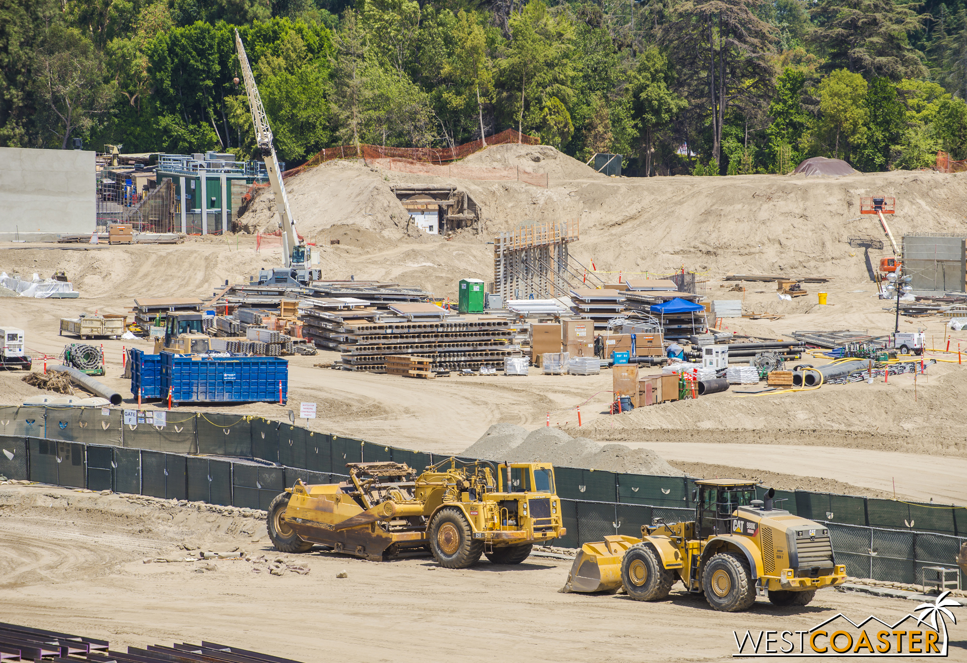 More formwork for more concrete walls going up. More formwork for more concrete walls just totally stacked on the ground, ready for repositioning.