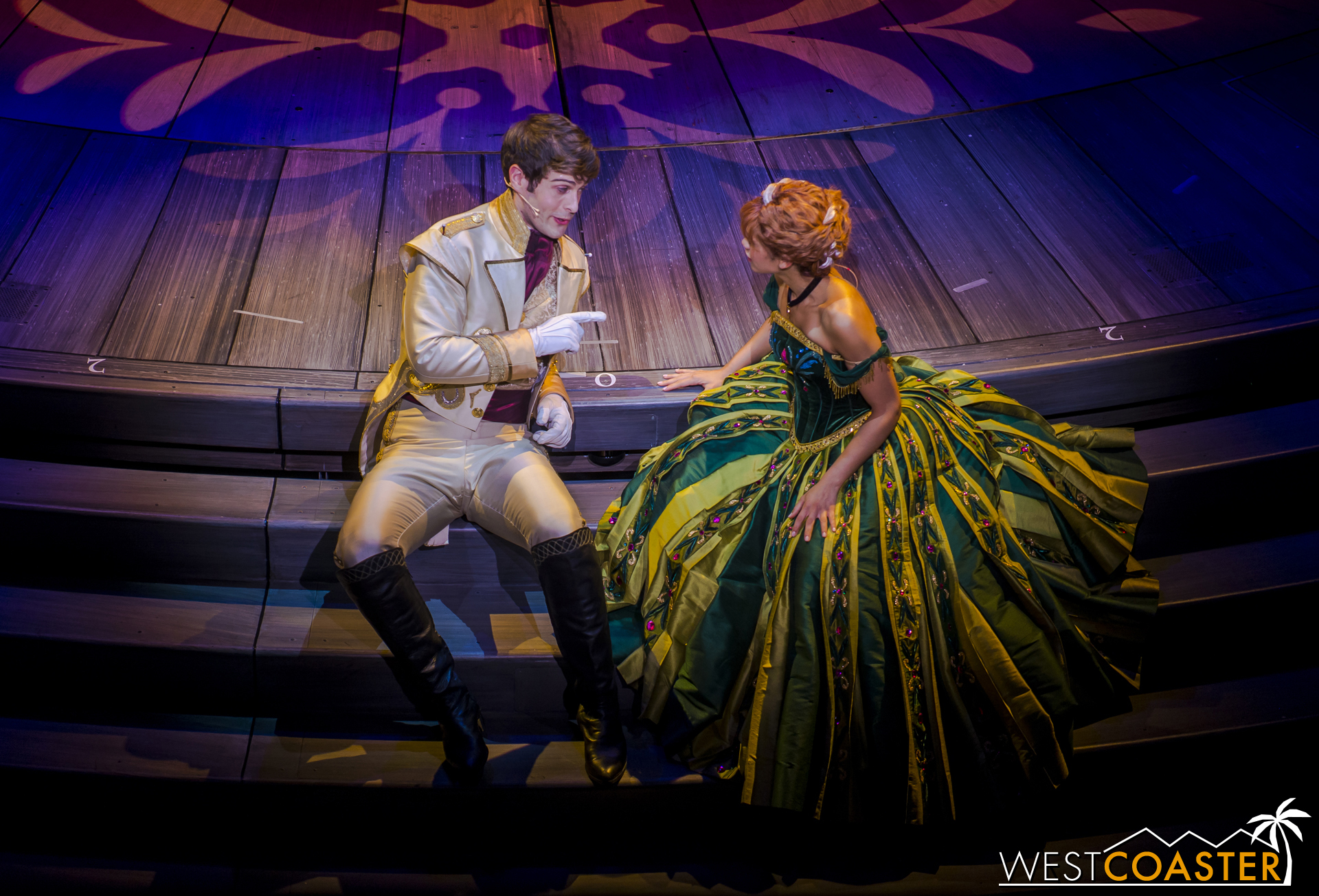 While Elsa isn't looking, Hans and Anna quietly discuss contingency plans in case the great dance does not sway Elsa.