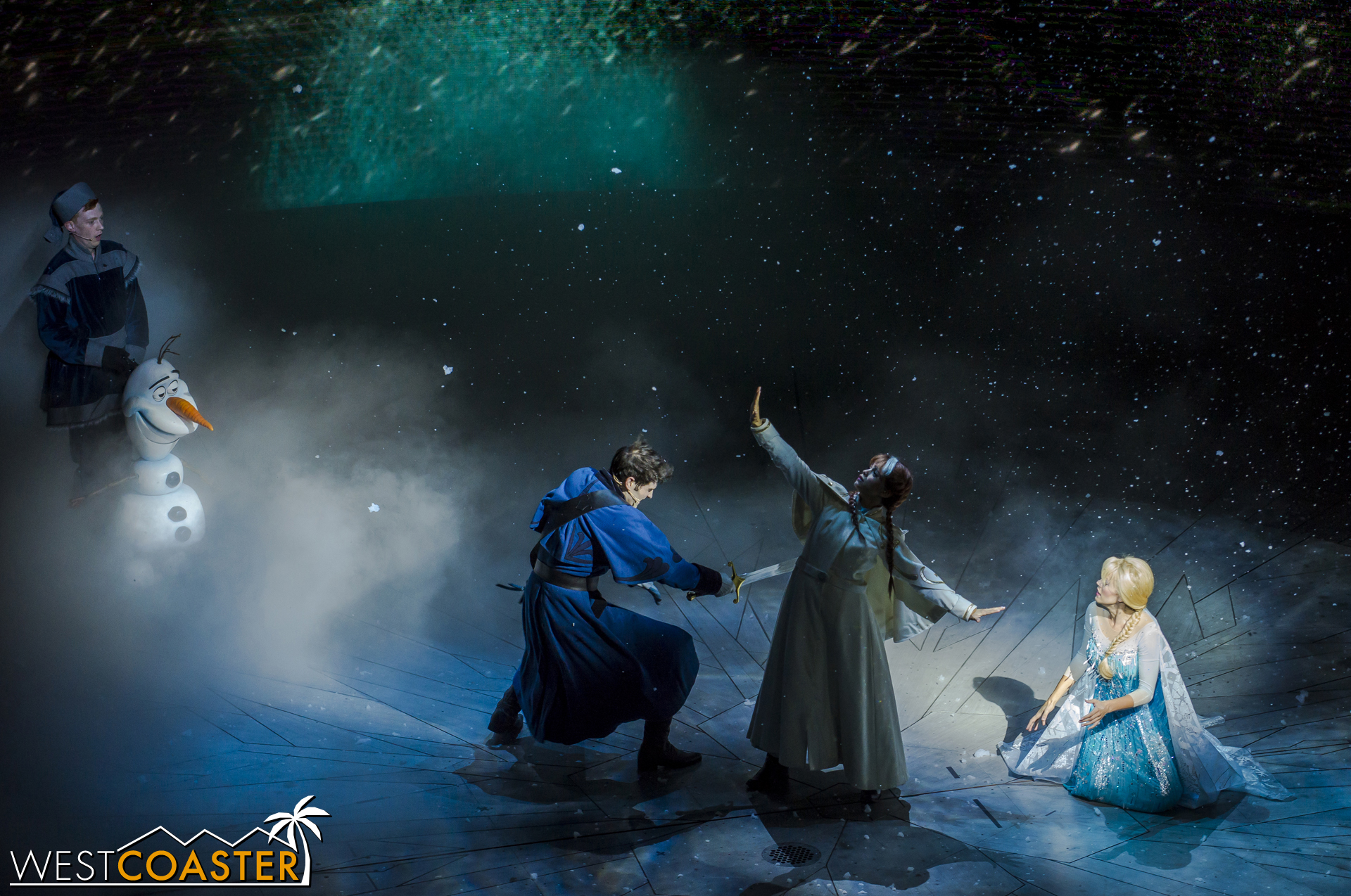 Summoning his last bit of strength, Hans pulls a sword out of a nearby Sorting Hat and prepares to strike Elsa with the killing blow. However, Elsa uses telekinesis to move her sister into the way!