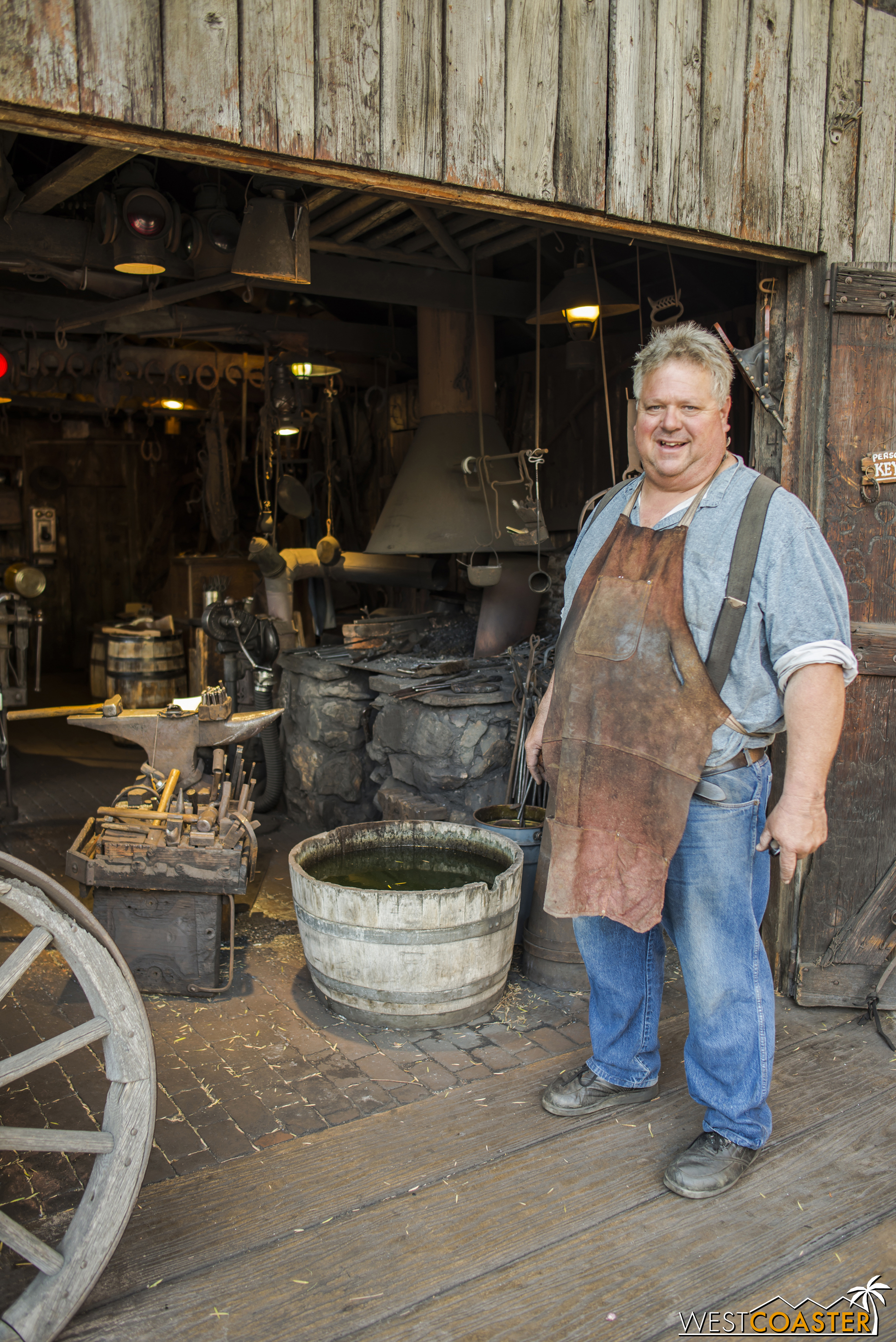  The blacksmith poses for a picture while taking a brief break from his work. 