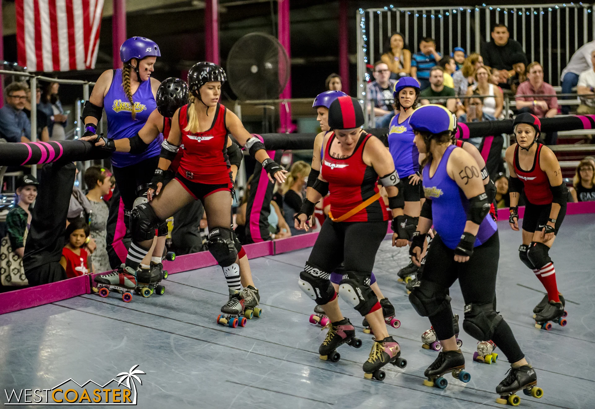Blockers and jammers line up at the starting line of a jam.