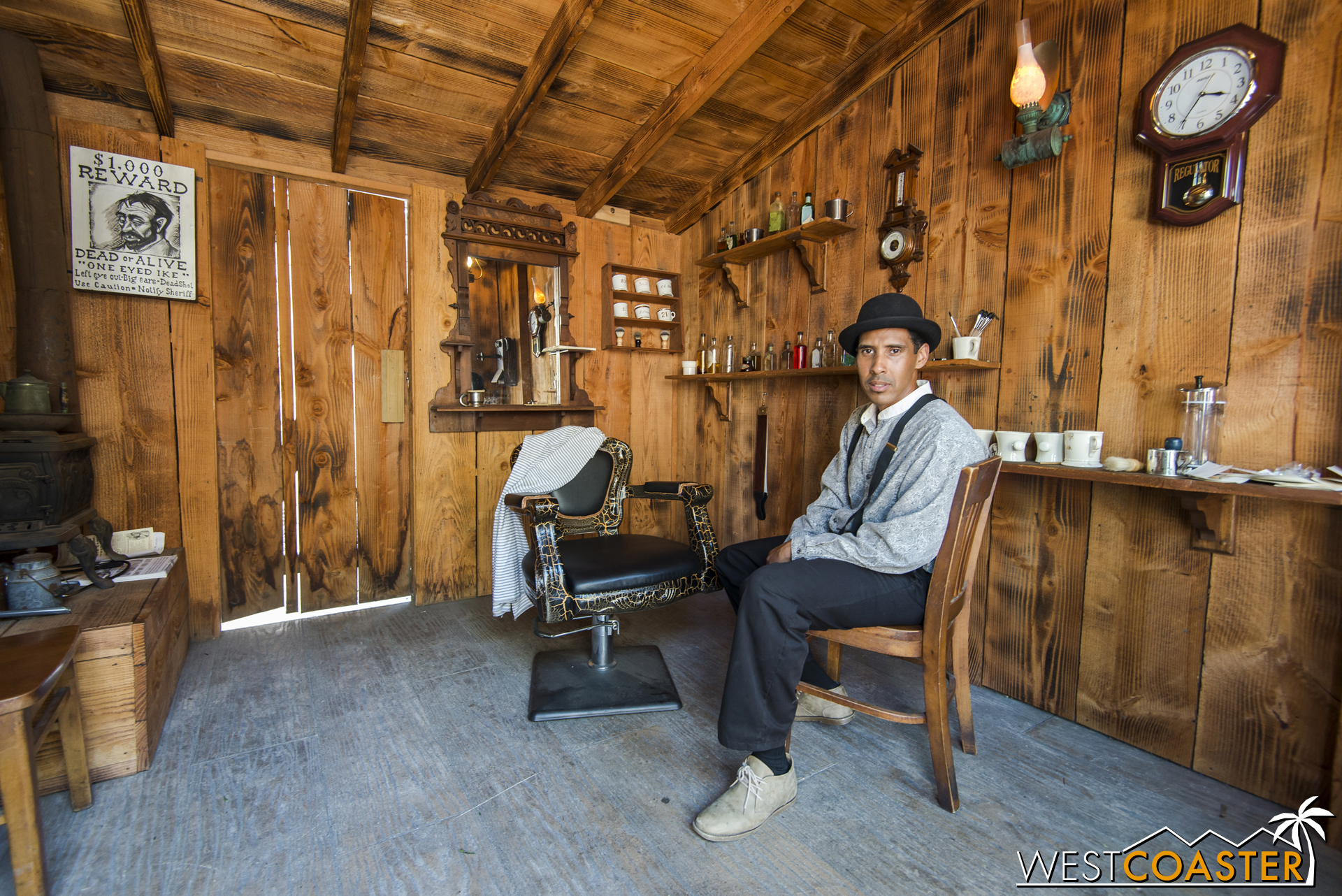  The barber of Calico, Mr. Percy Boyer, poses in his barbershop, one of the many peek-in's of Ghost Town opened up for Ghost Town Alive! 
