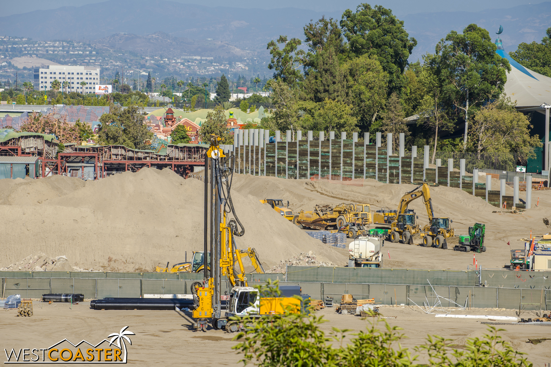  Across the back, more shoring and piles are going in for what looks to like a future tall structure. 