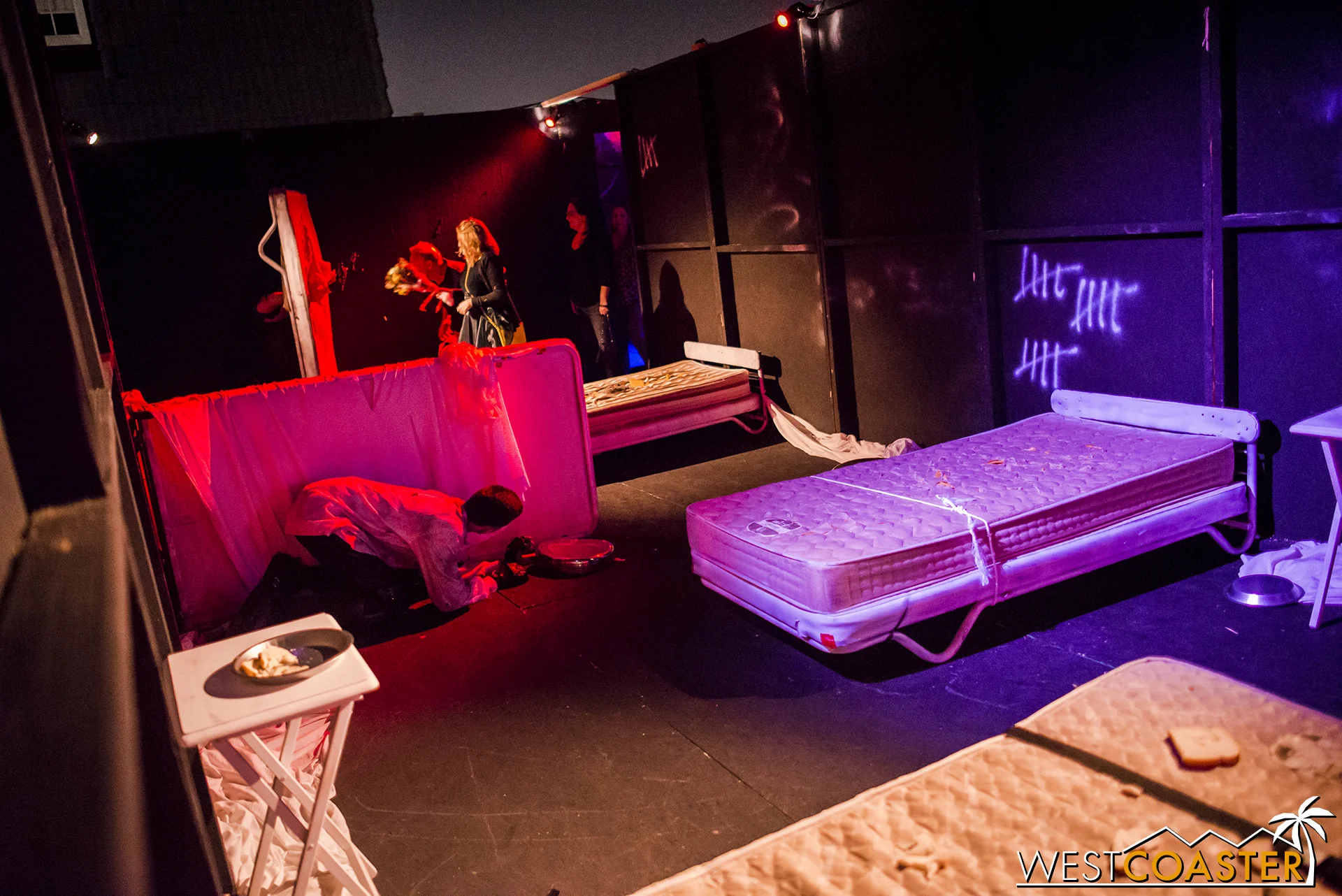 Guests entering in the background might get a scare from a mattress!