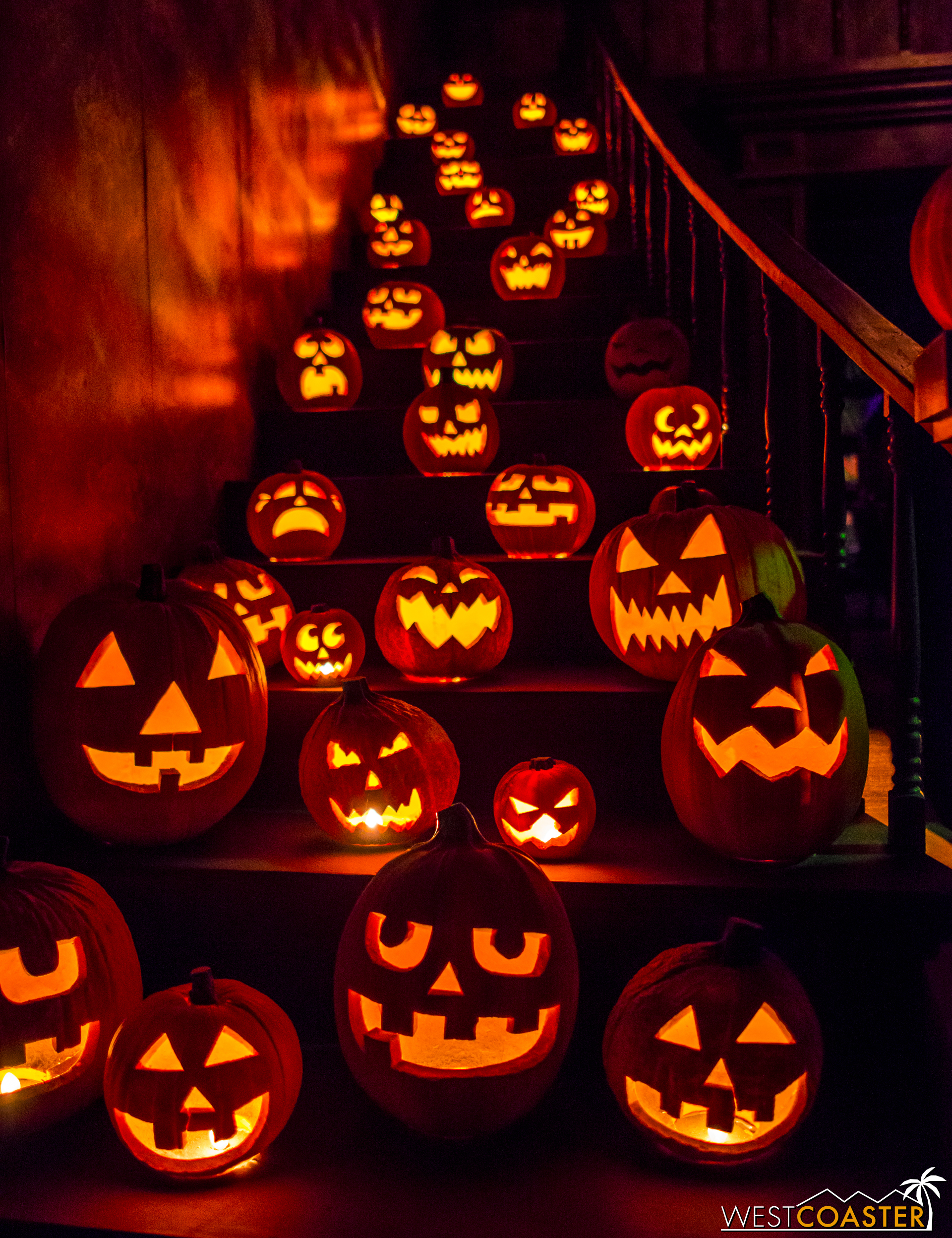  The dramatic jack-o-lantern staircase unfolds as guests walk in. 