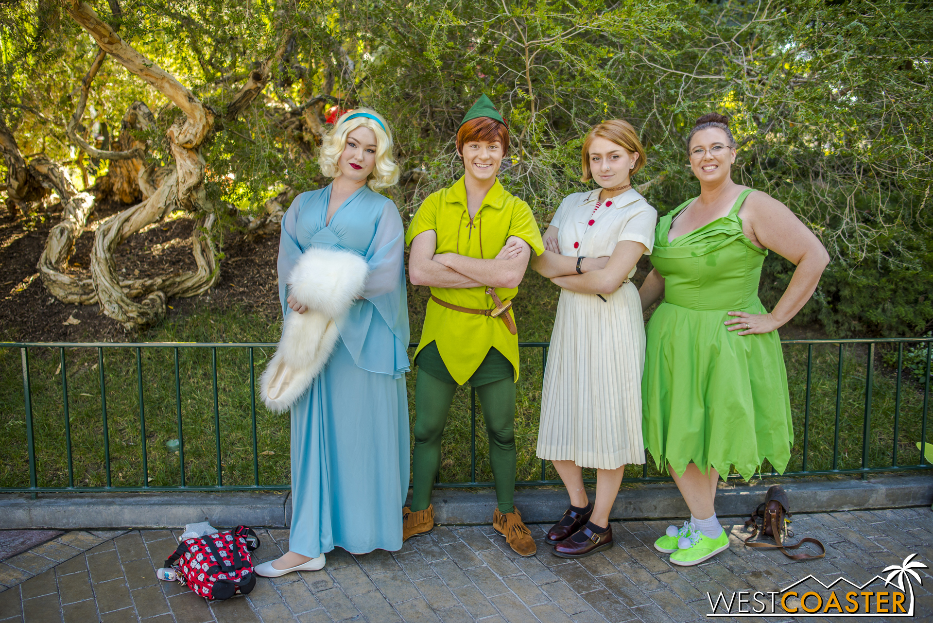  In this assorted Disney character contingent, which one is the actual cast member? 