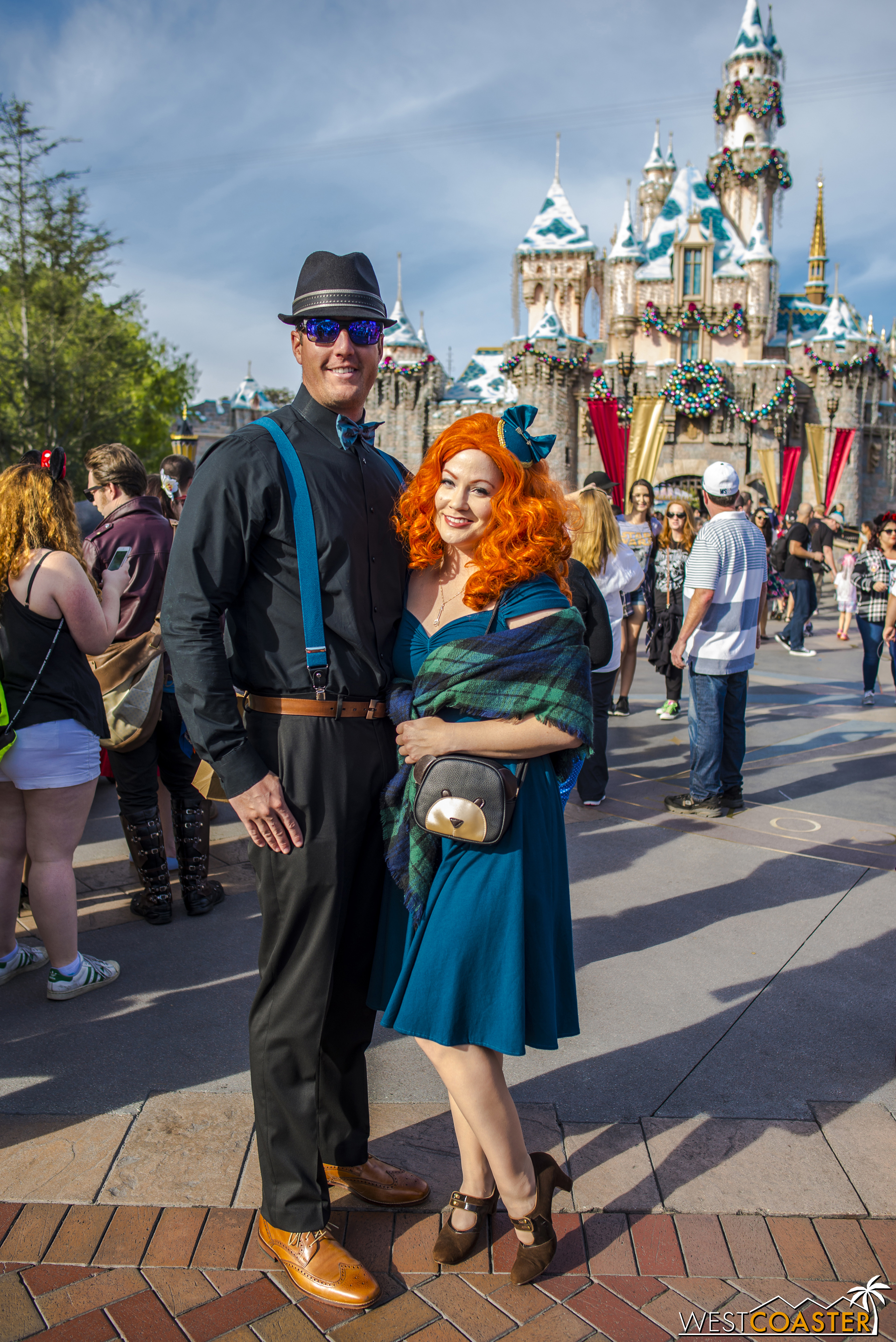  Over in front of Sleeping Beauty Castle, Merida poses with her date. 