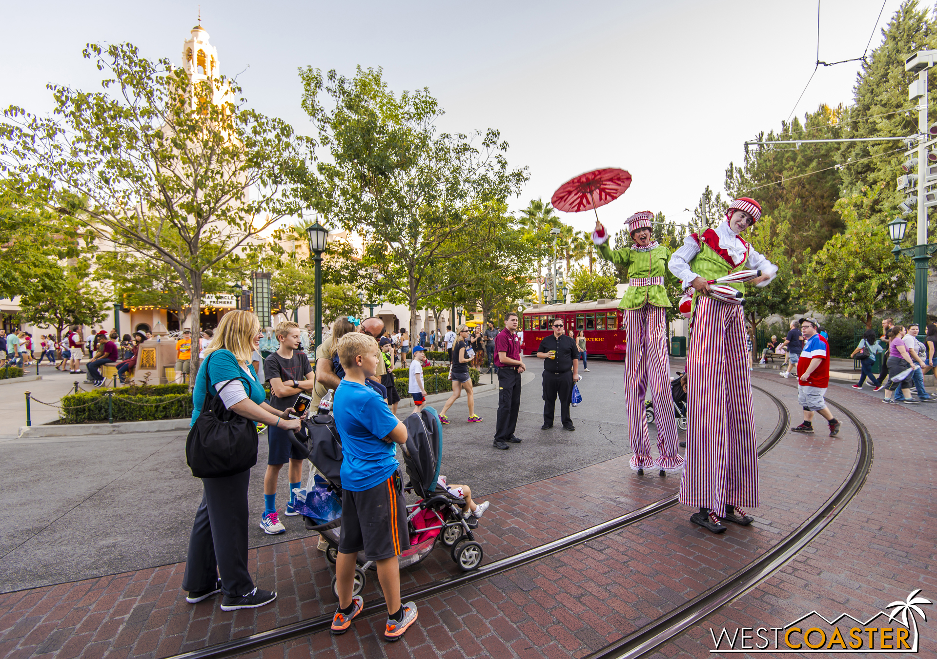  The Stilt Circus troupe interacts with guests inside the park. 