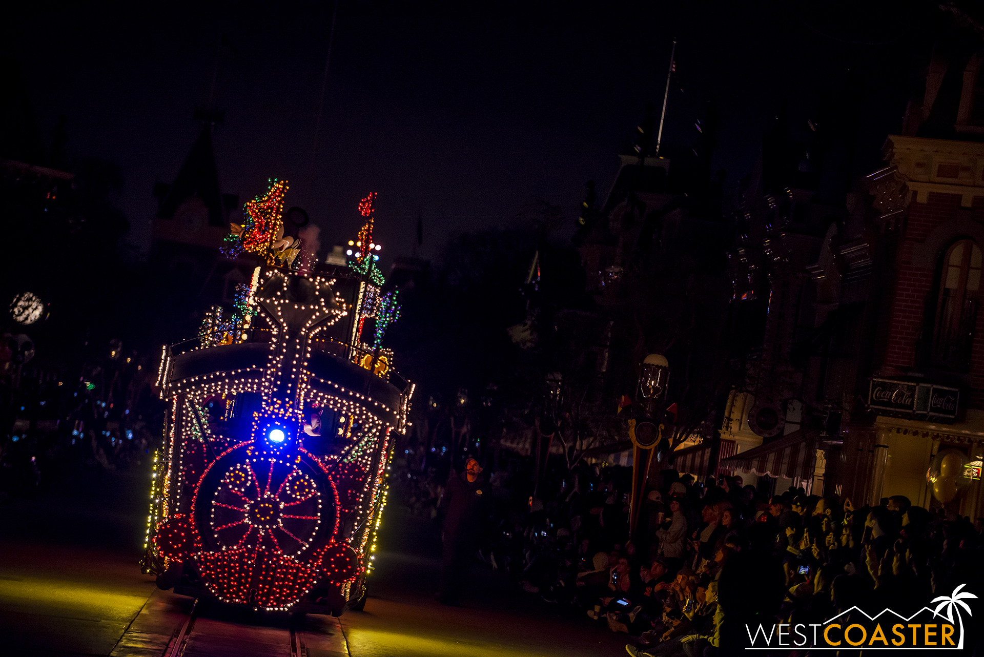 The Main Street Electrical Parade begins with the recognizable Casey Jr. Train chugging down the street.