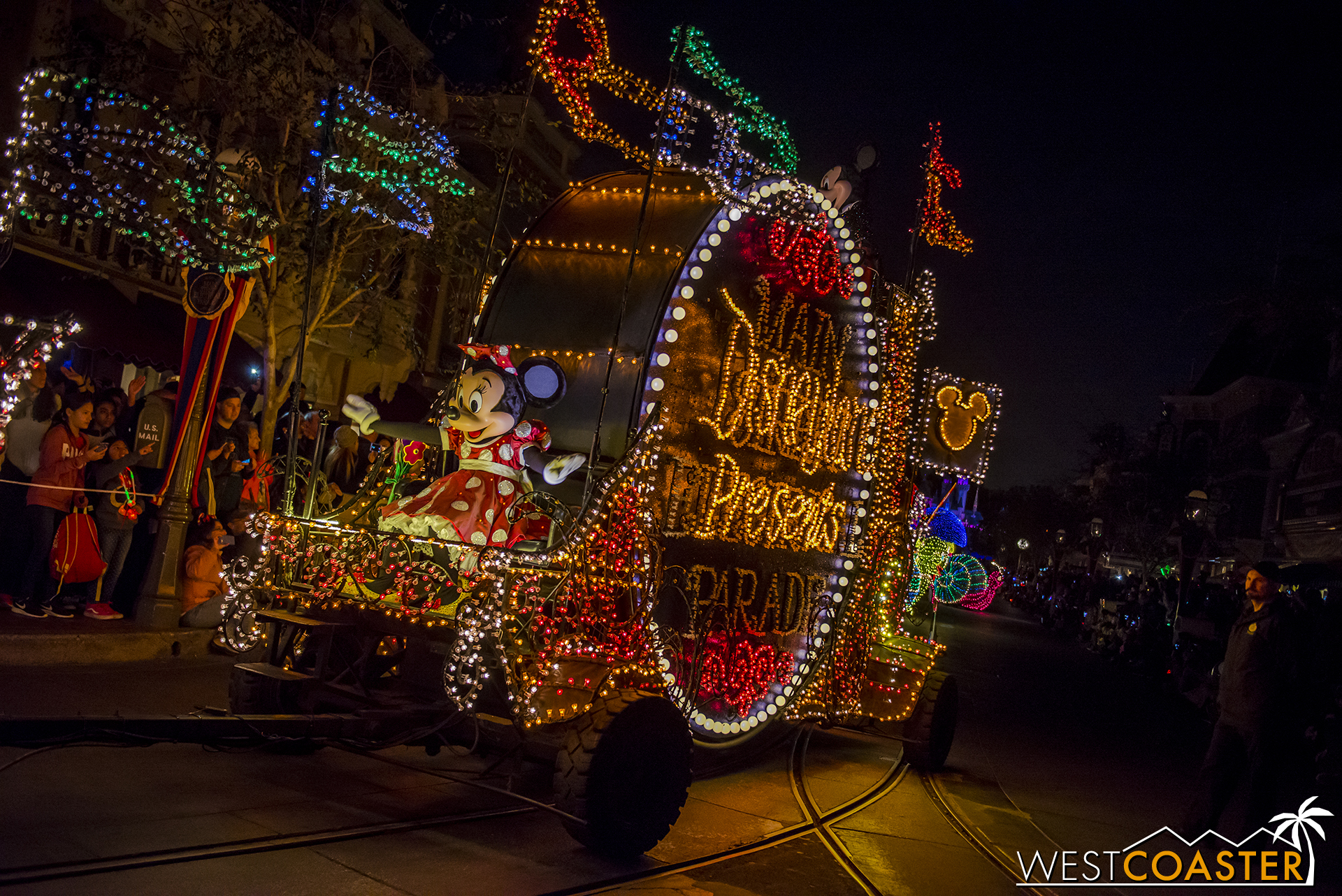 Minnie rides at the front of the classic parade marquee drum.