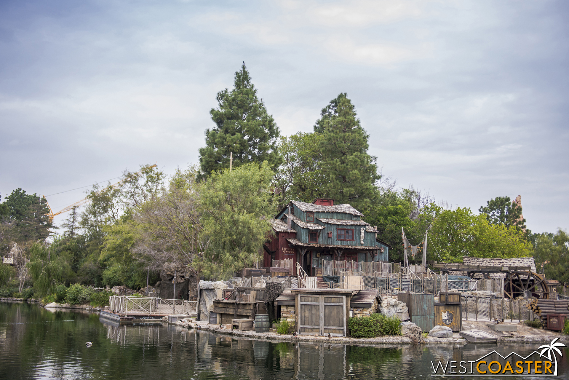 We move along toward the New Orleans Square side. Mr. Crane can be glimpsed in the background, giving an idea of its scale.