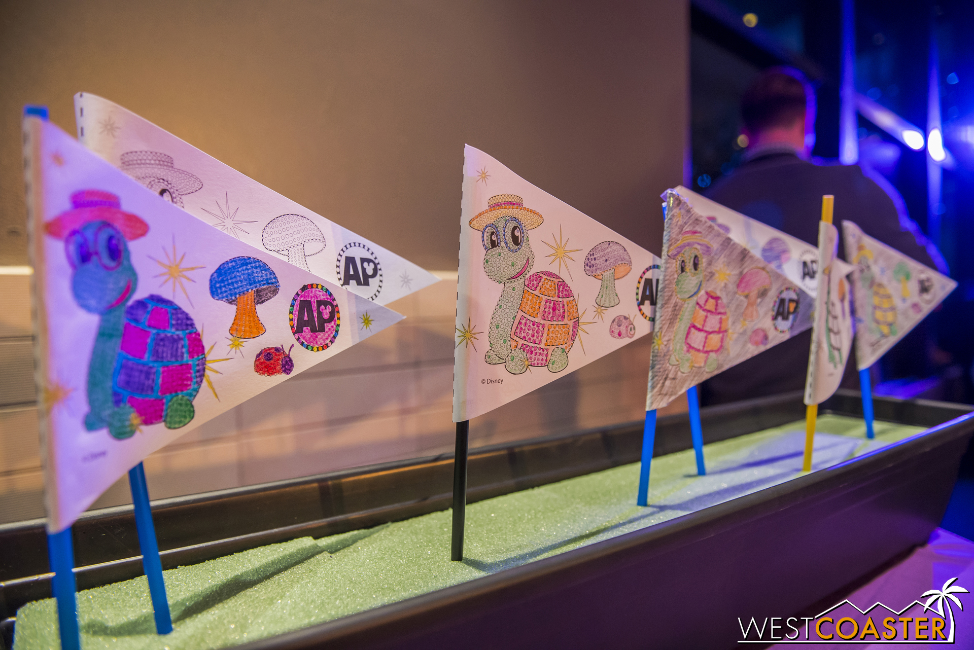A separate activity area is available for kids who want to color their own pennants.