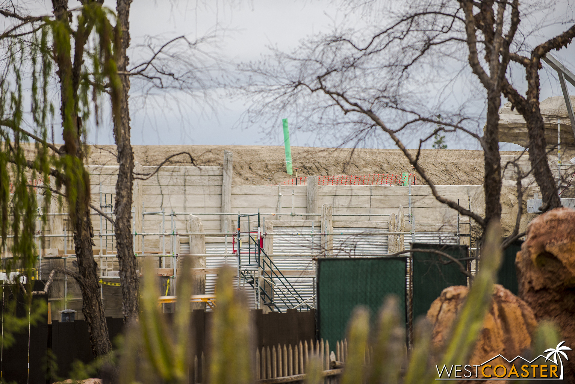  Meanwhile, over by Big Thunder Mountain, a zoomed in glimpse over the walls reveals what looks an awful lot like roll-up garage doors, but is actually just corrugated metal siding. 