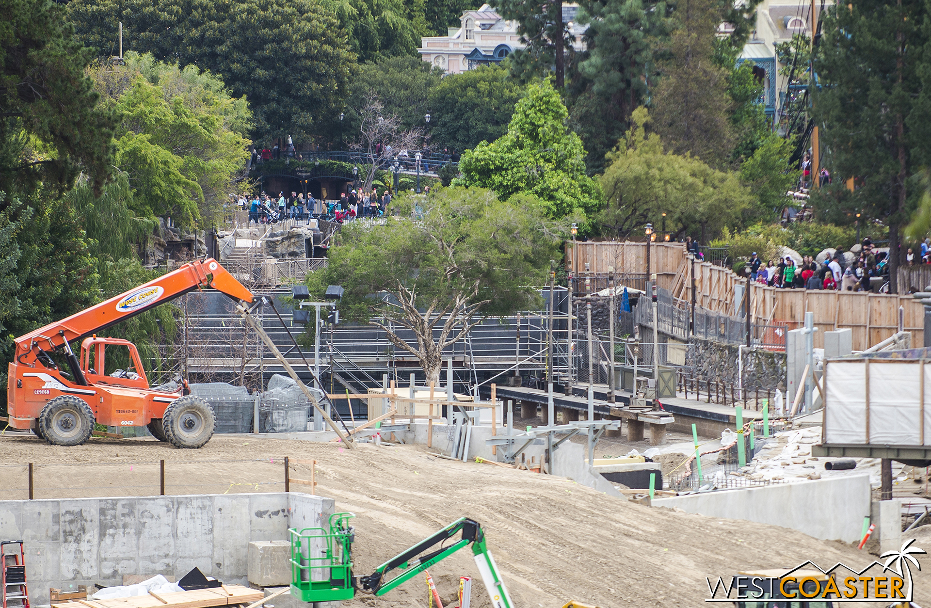  This is purely my own speculation, but said bridge/pathway might be the back entrance into "Star Wars" Land, angling along the reconfigured bank of the Rivers of America briefly before crossing over or under the Disneyland Railroad to enter Star War