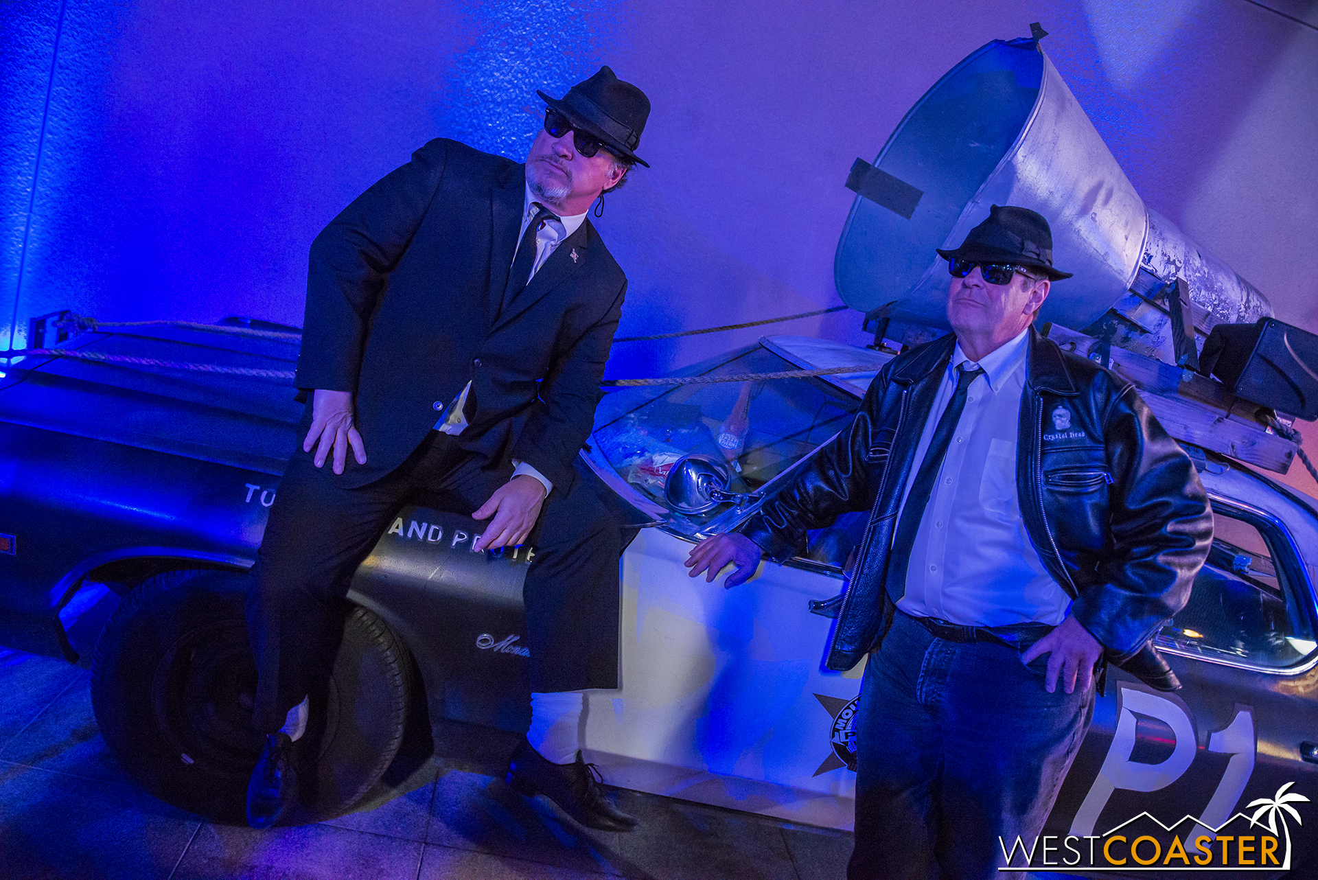 Posing with their unmistakable cruiser.