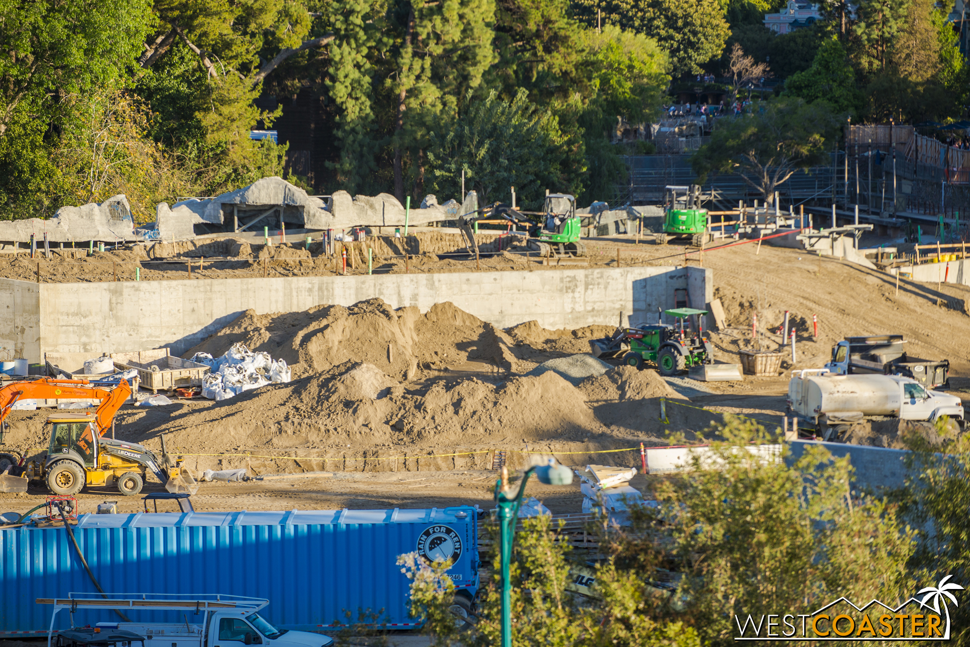 Back along the Rivers of America, the rockwork slowly continues.