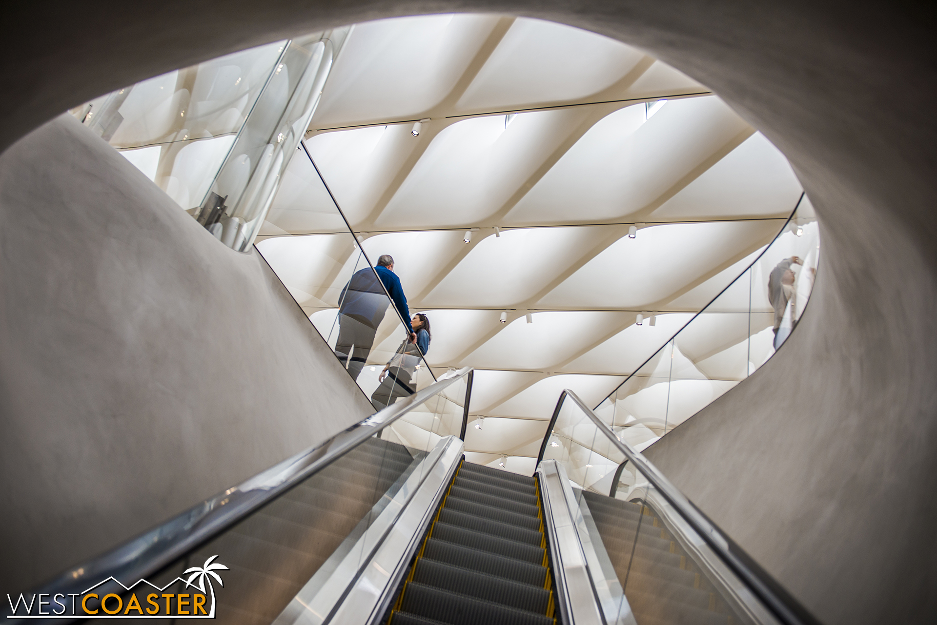 The 105 foot long escalator also provides a surreal processional experience up to the permanent galleries.