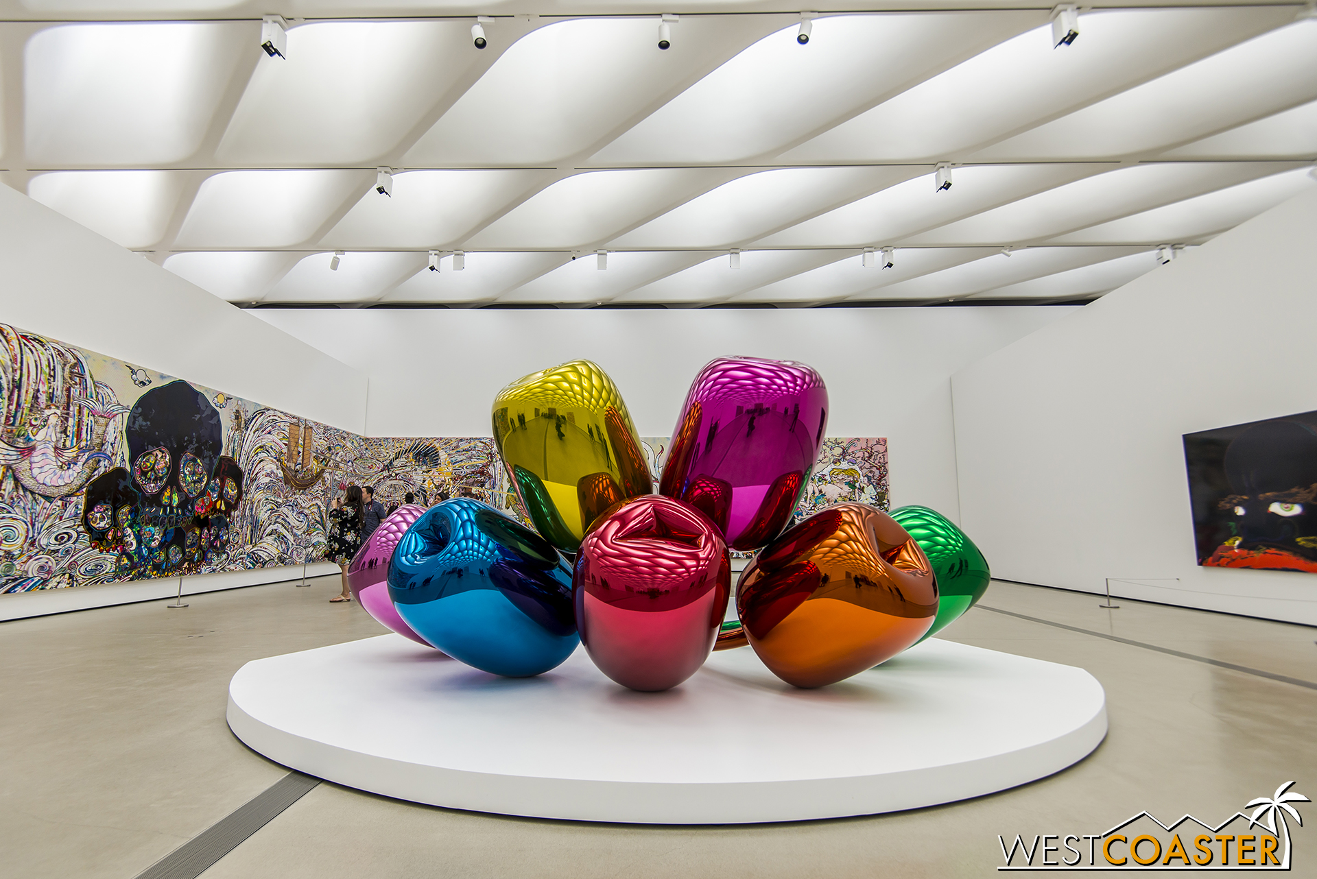 Likewise, Koons' famous Tulips piece is the first art sculpture scene by guests exiting the escalator.