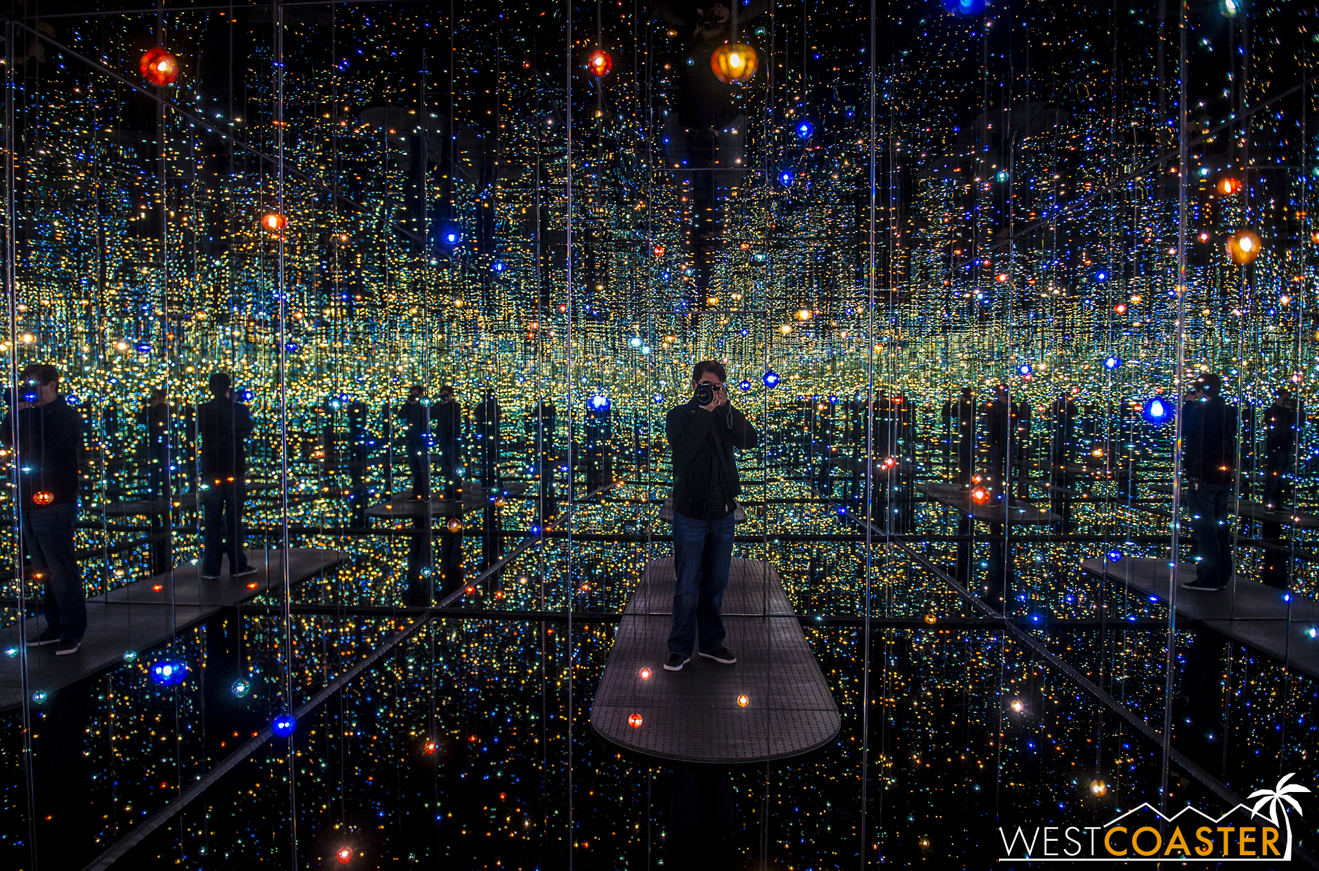 Standing inside the Infinity Mirrored Room .