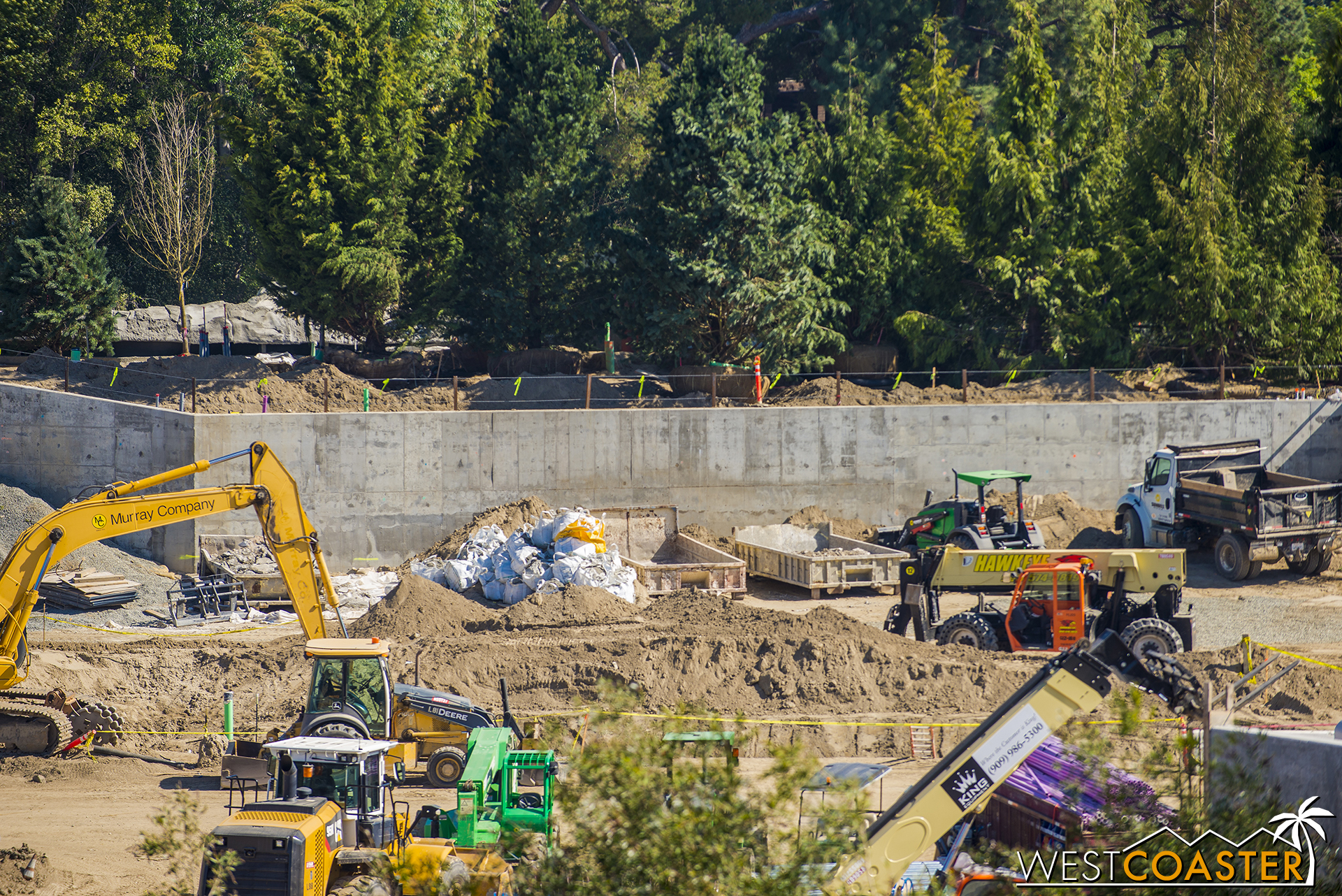 The line of trees is surprisingly denser and taller than I expected with how relatively dirt appears to be retained behind the walls, but it's probably an illusion due to the compression of depth from the telephoto lens.