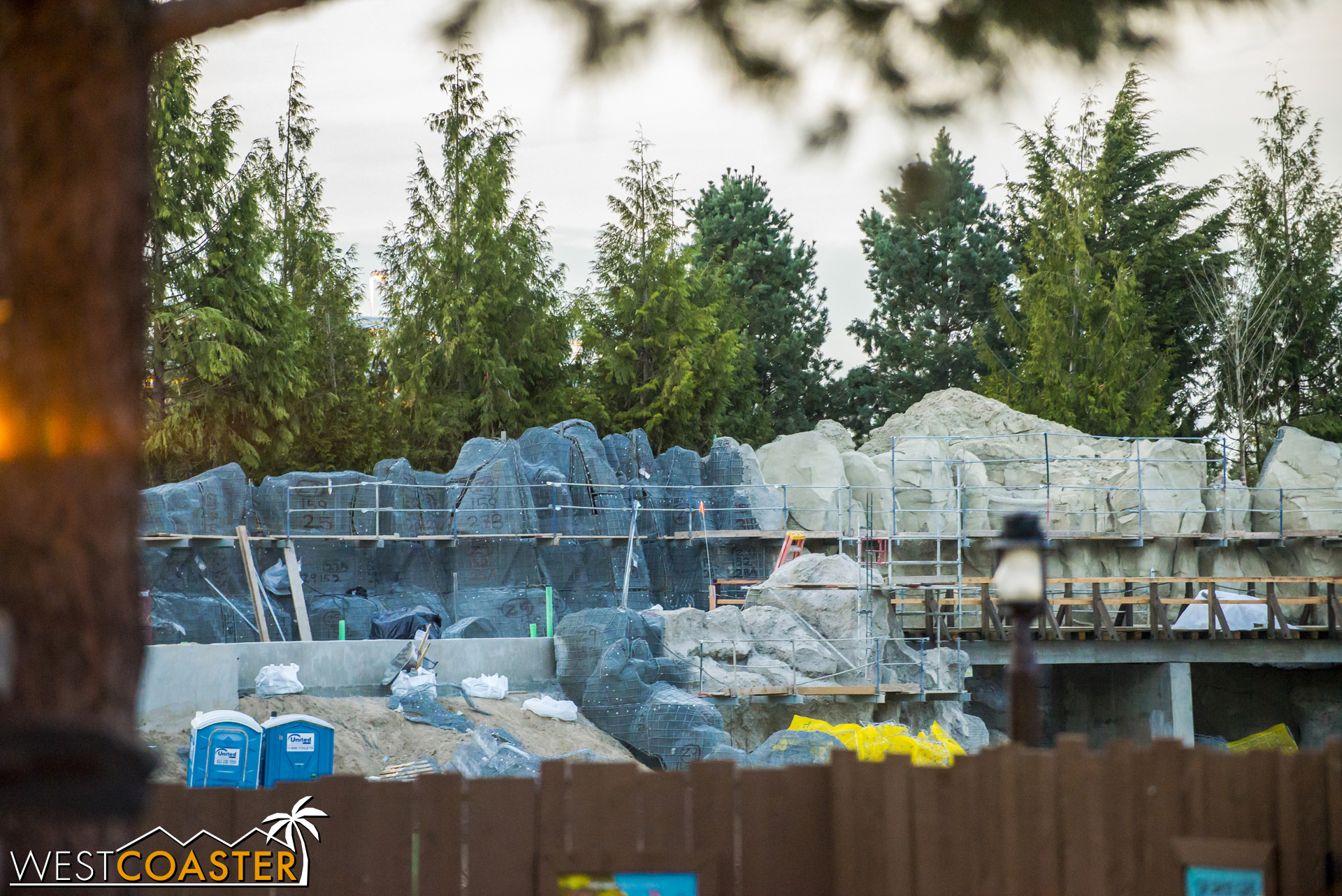  A glimpse over the work walls by Critter Country shows more progress on the rockwork. 