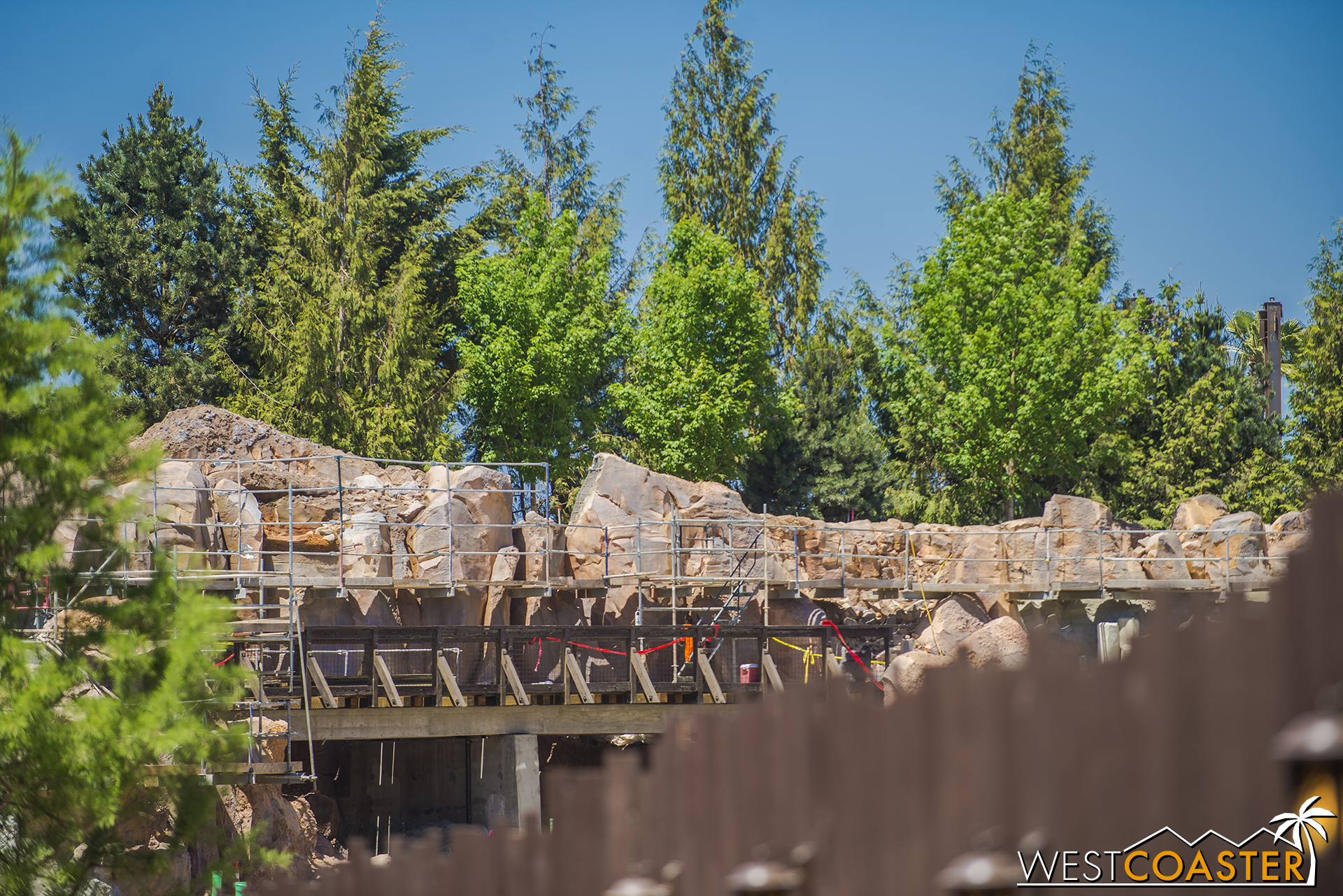  Peering over the work wall from the Hungry Bear walkway area. 