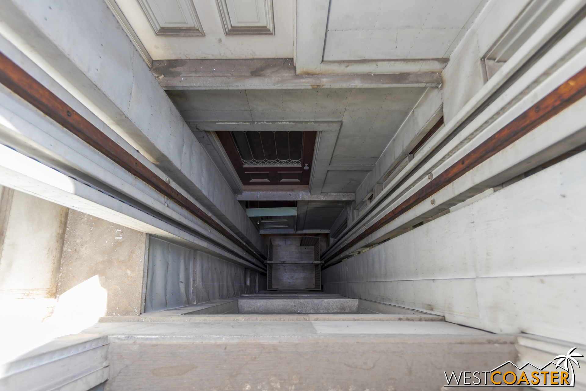 Looking down the tallest elevator shaft in the house, which runs up every level.