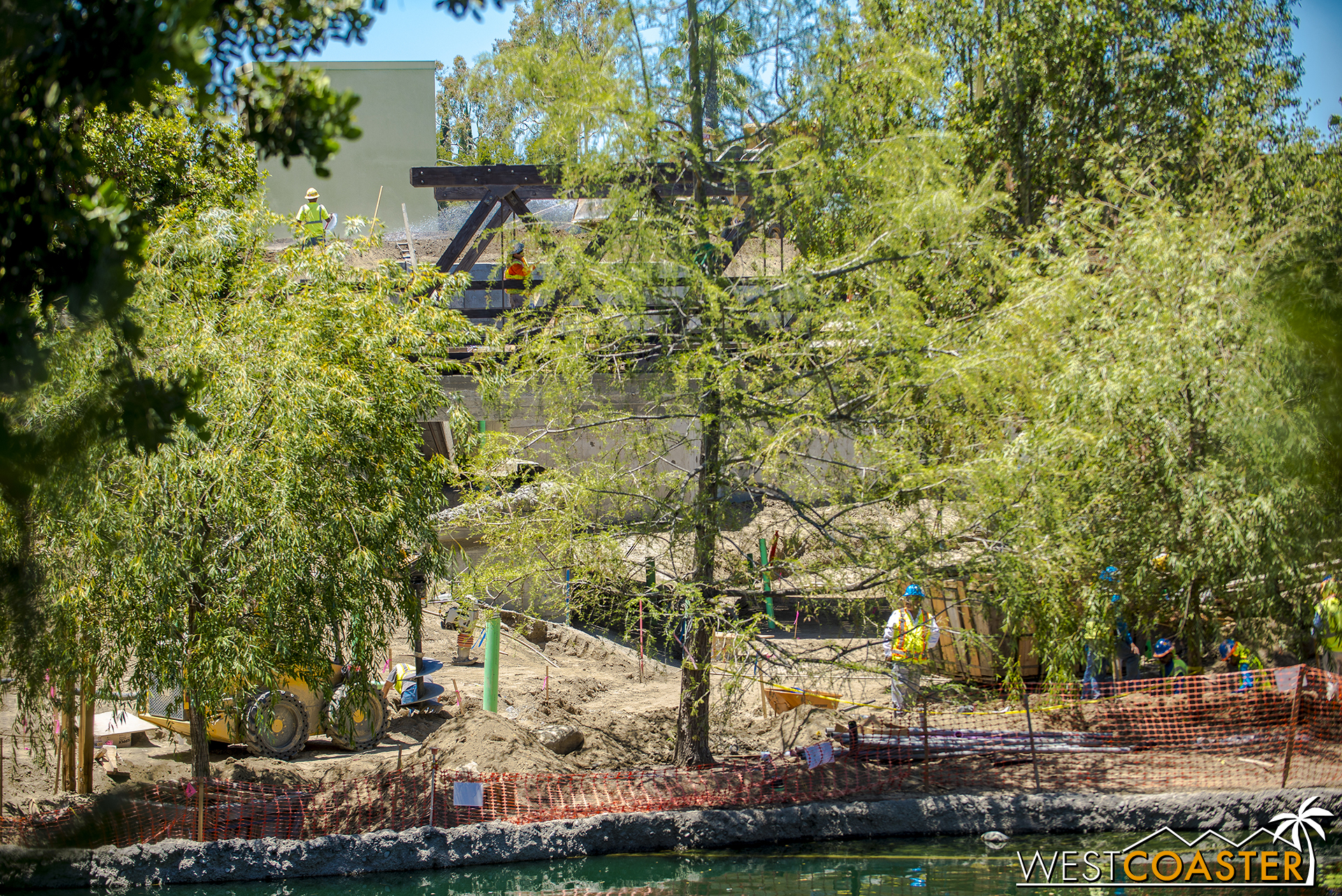  This series is moving "southward" from the interior of the Rivers of America toward Critter Country, so you can see a glimpse of that truss bridge again. 