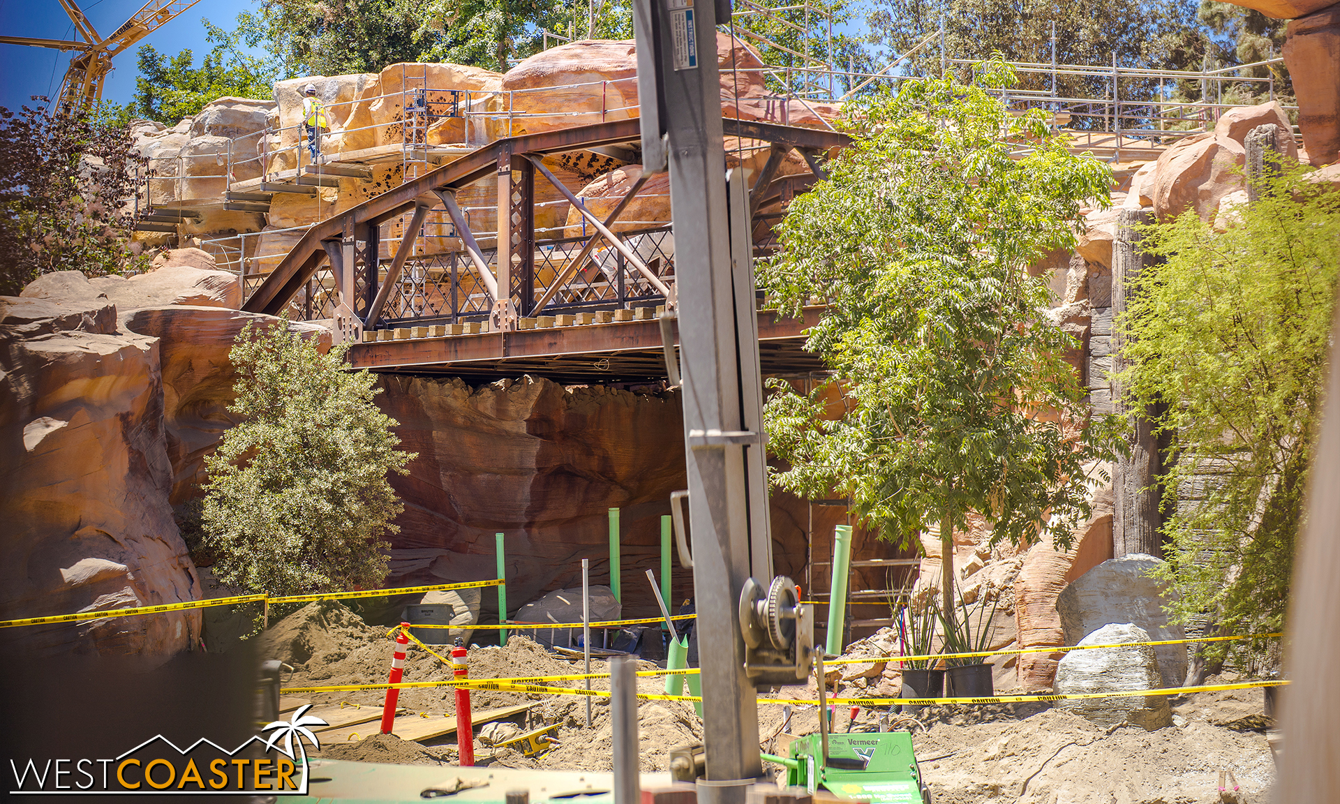  A peek between the slots reveals this: another arch bridge over which the Disneyland Railroad will run. 