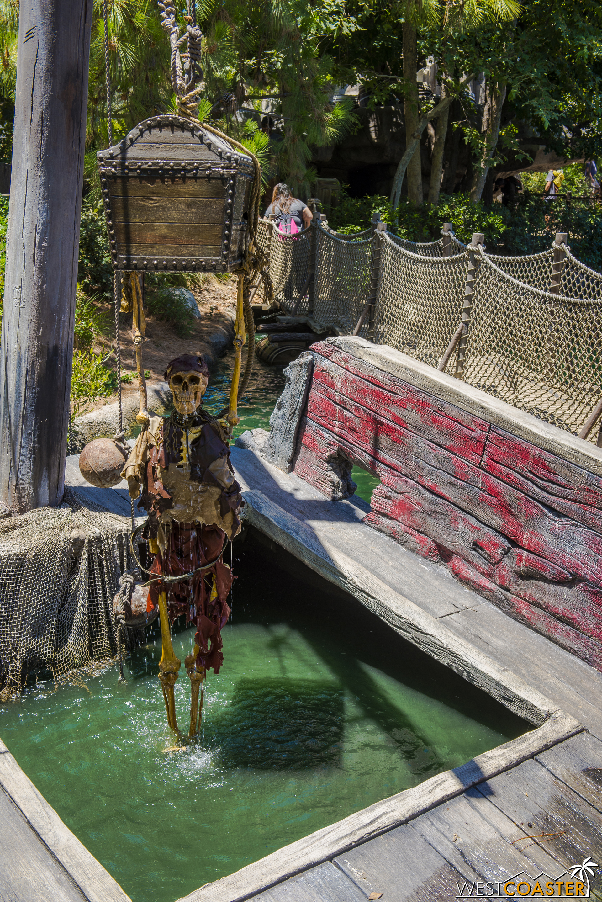  A pirate skeleton clutching a treasure chest is unveiled to those who crank a spinning wheel carefully. 