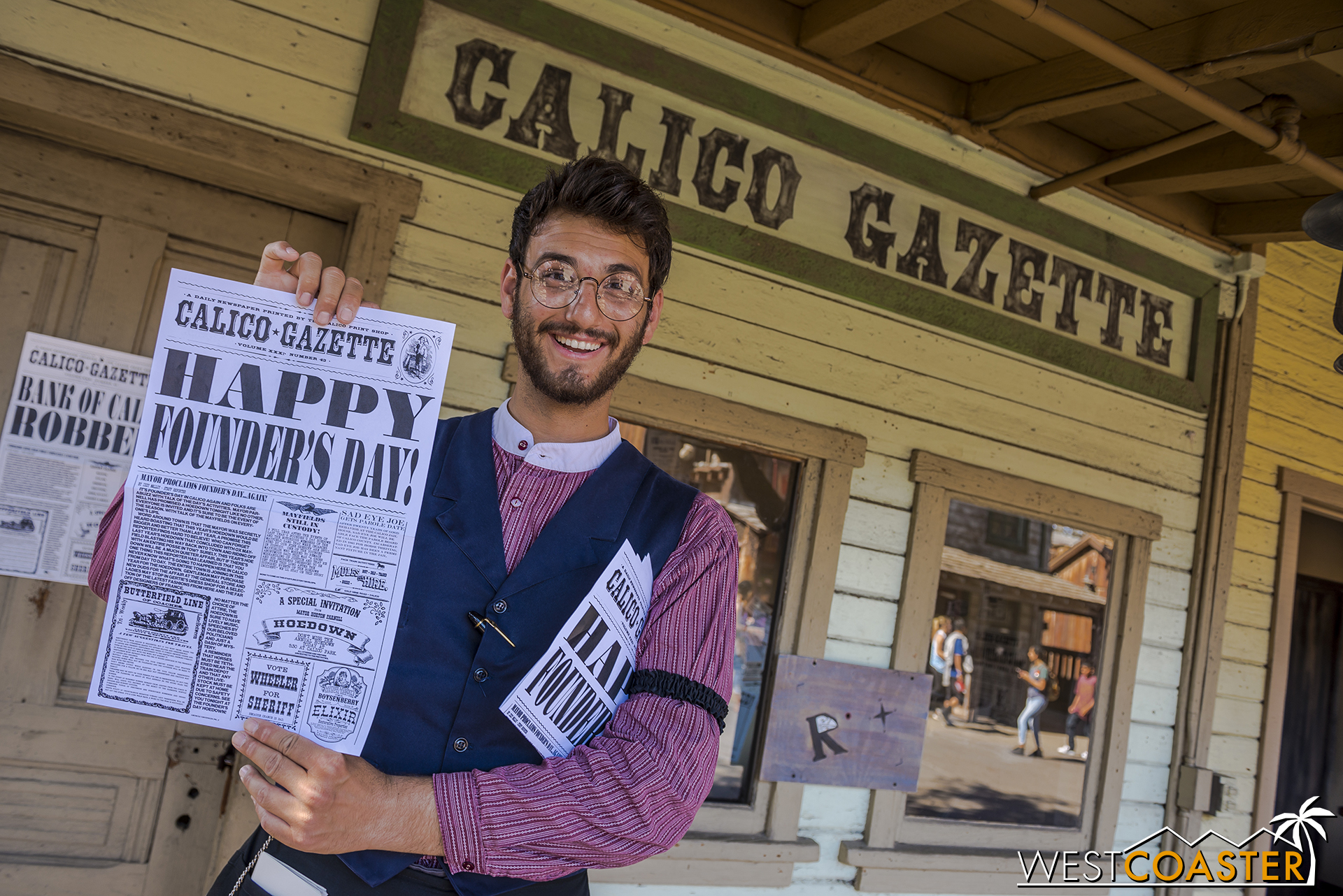  Newspaper editor Bixby Knolls holds up the latest edition of the Calico Gazette, which makes multiple printings a day and even includes the names of some interacting guests. 