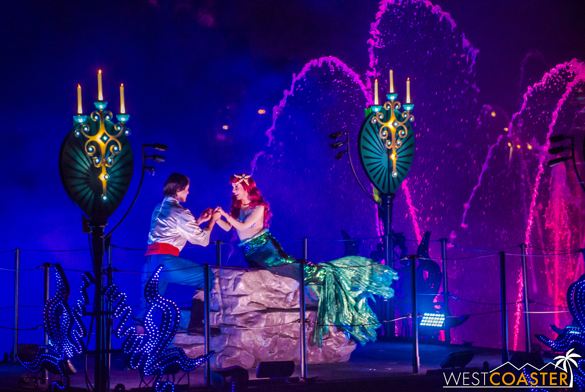  Ariel and Prince Eric share the stage in their barge as well, as Ariel ponders what she would give if she could live out of these waters. 