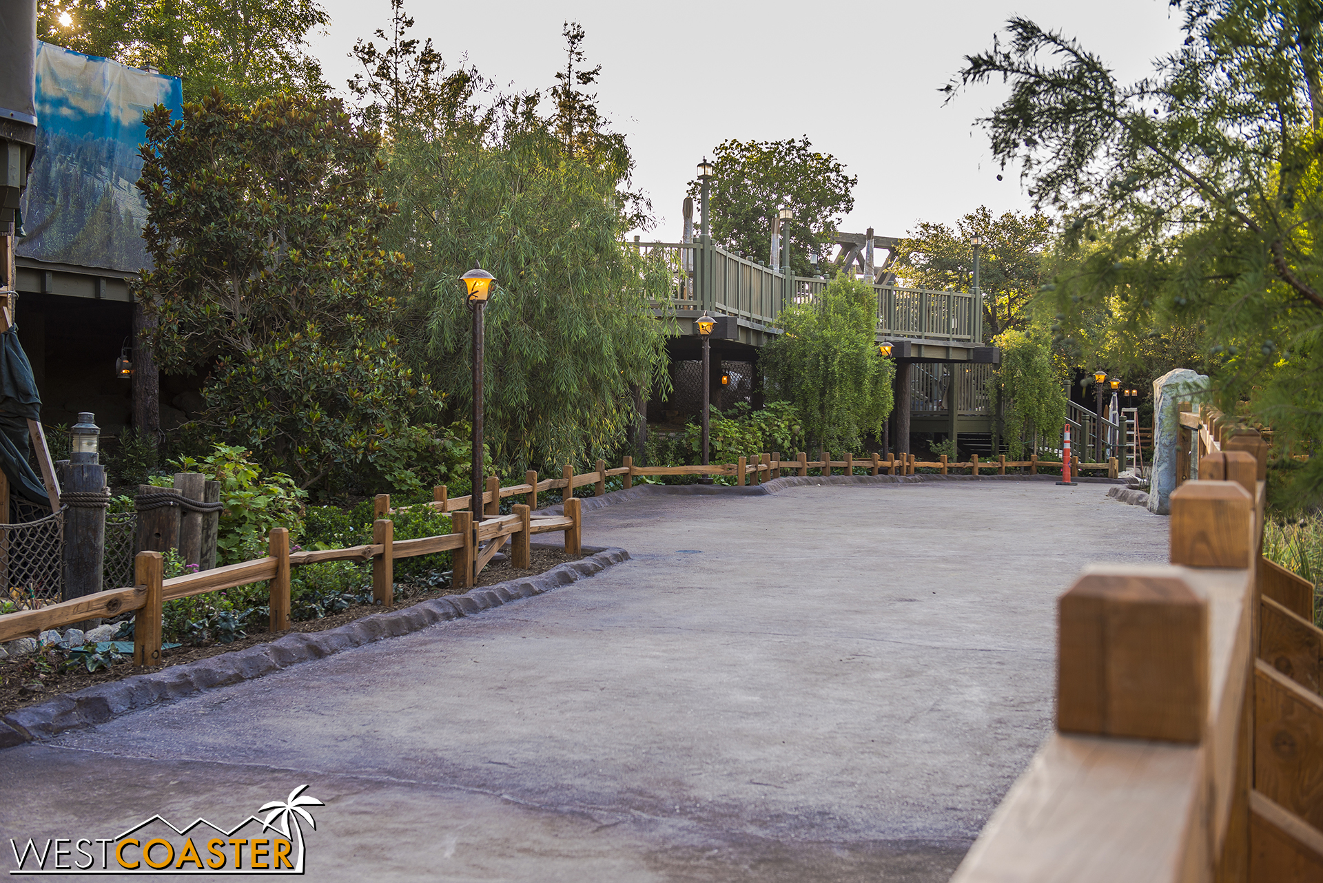  Spying around the work wall that blocks the path shows how it will continue on eventually to that underpass below the bridge we see from the Mickey and Friends Parking Structure. 