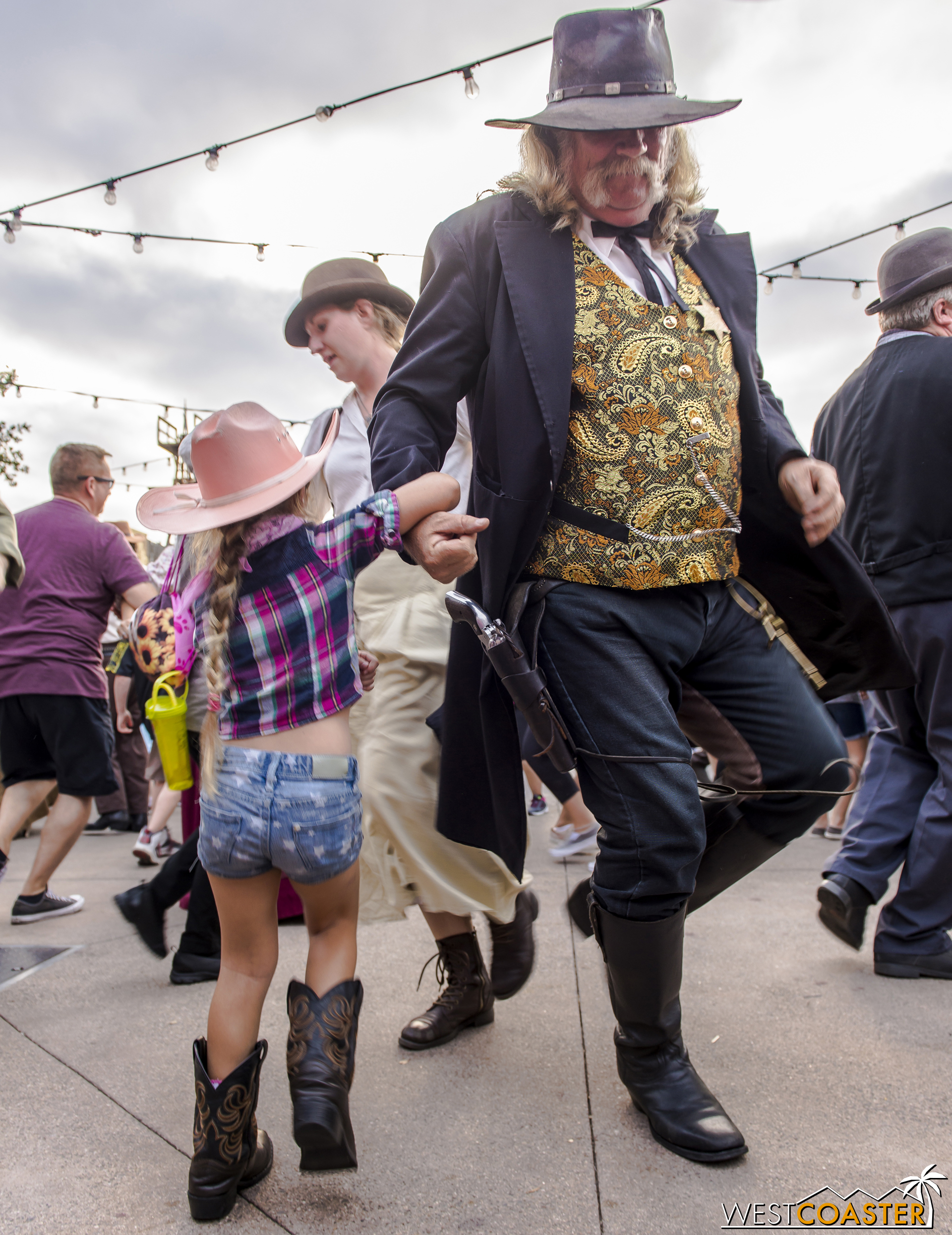 A young guest dances with Sheriff Wheeler at the Calico Founder's Day Hoedown. 