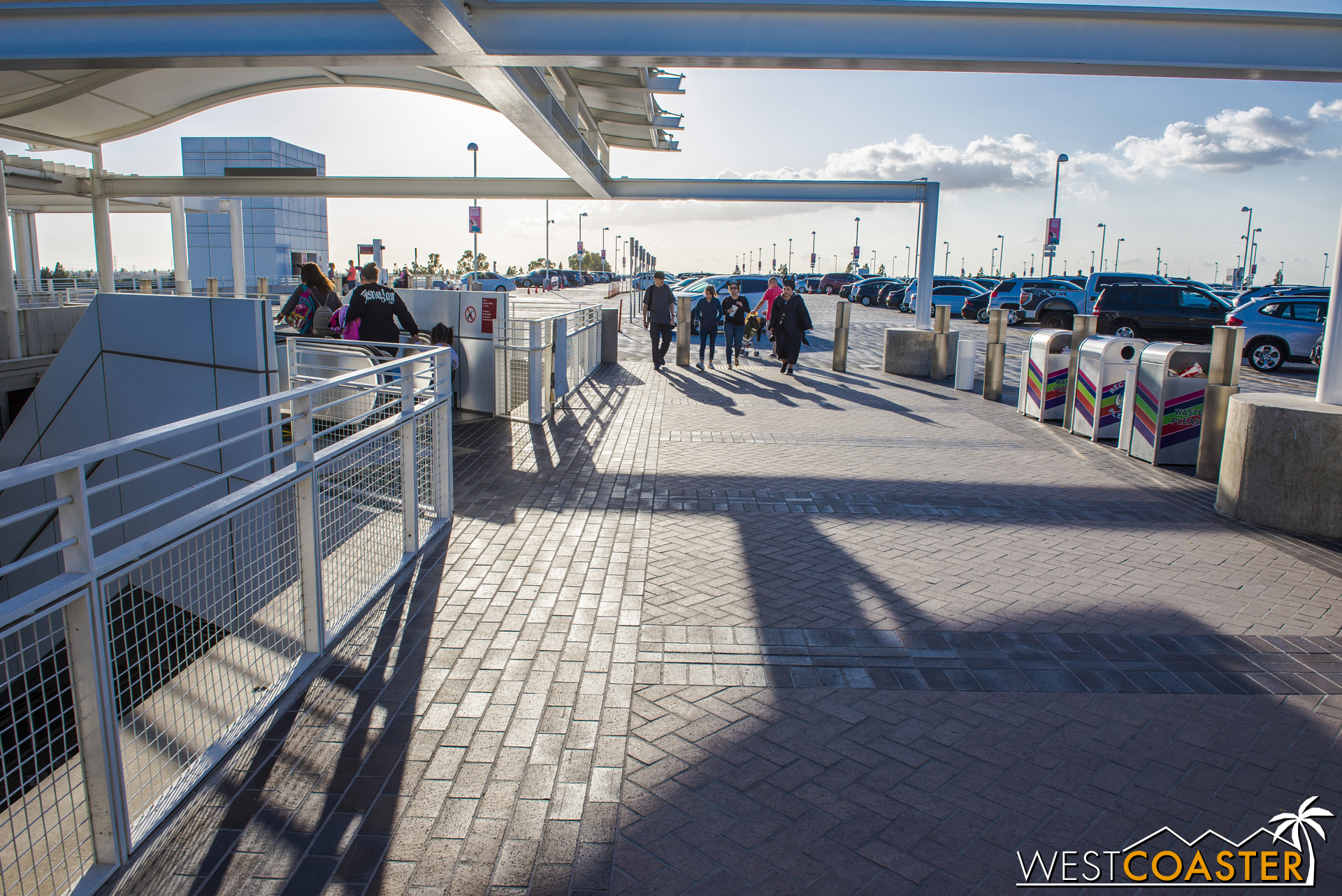  They extend around the top landings of the escalators. 