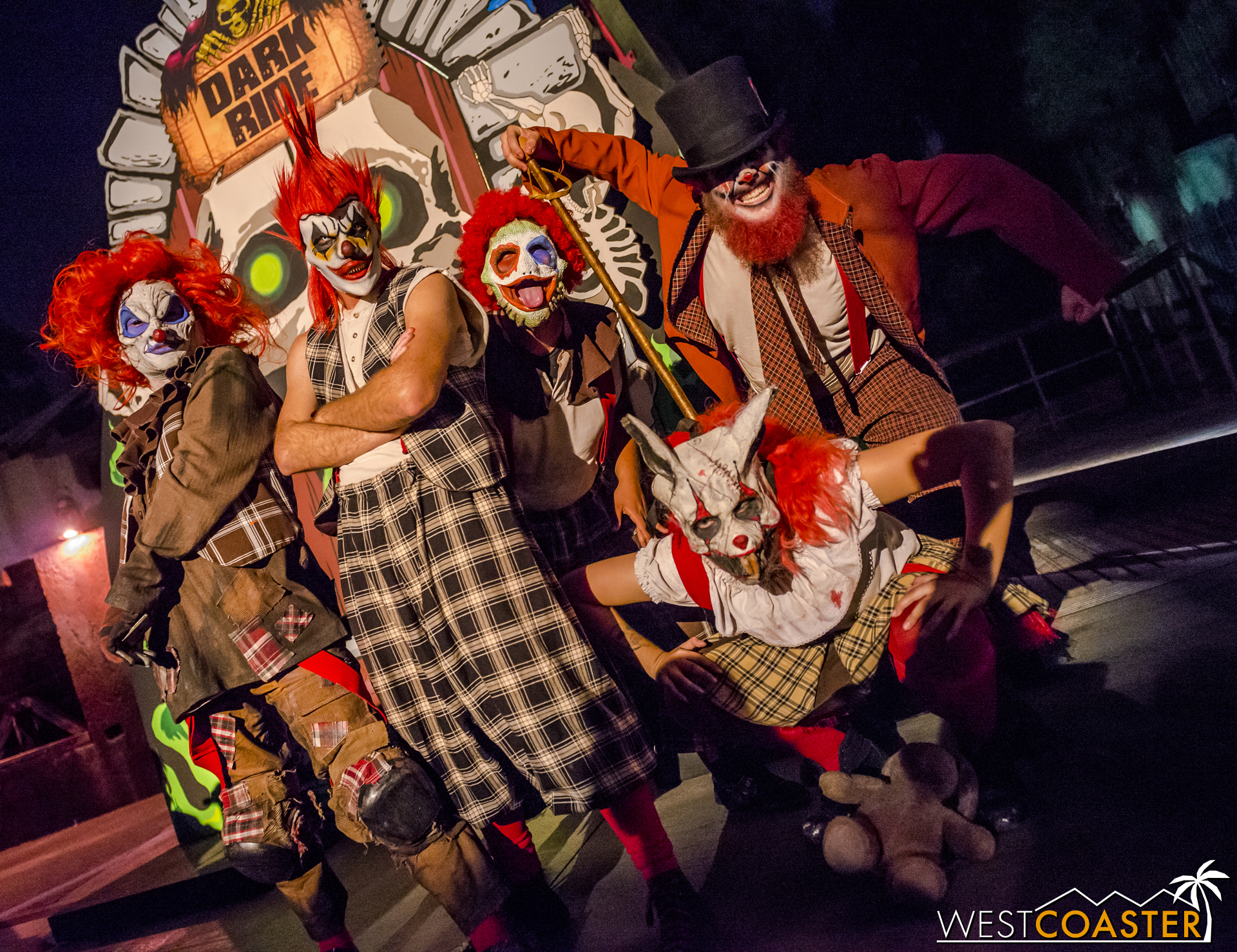  A gang of Carnevil clowns poses in front of the Dark Ride photo op backdrop. 