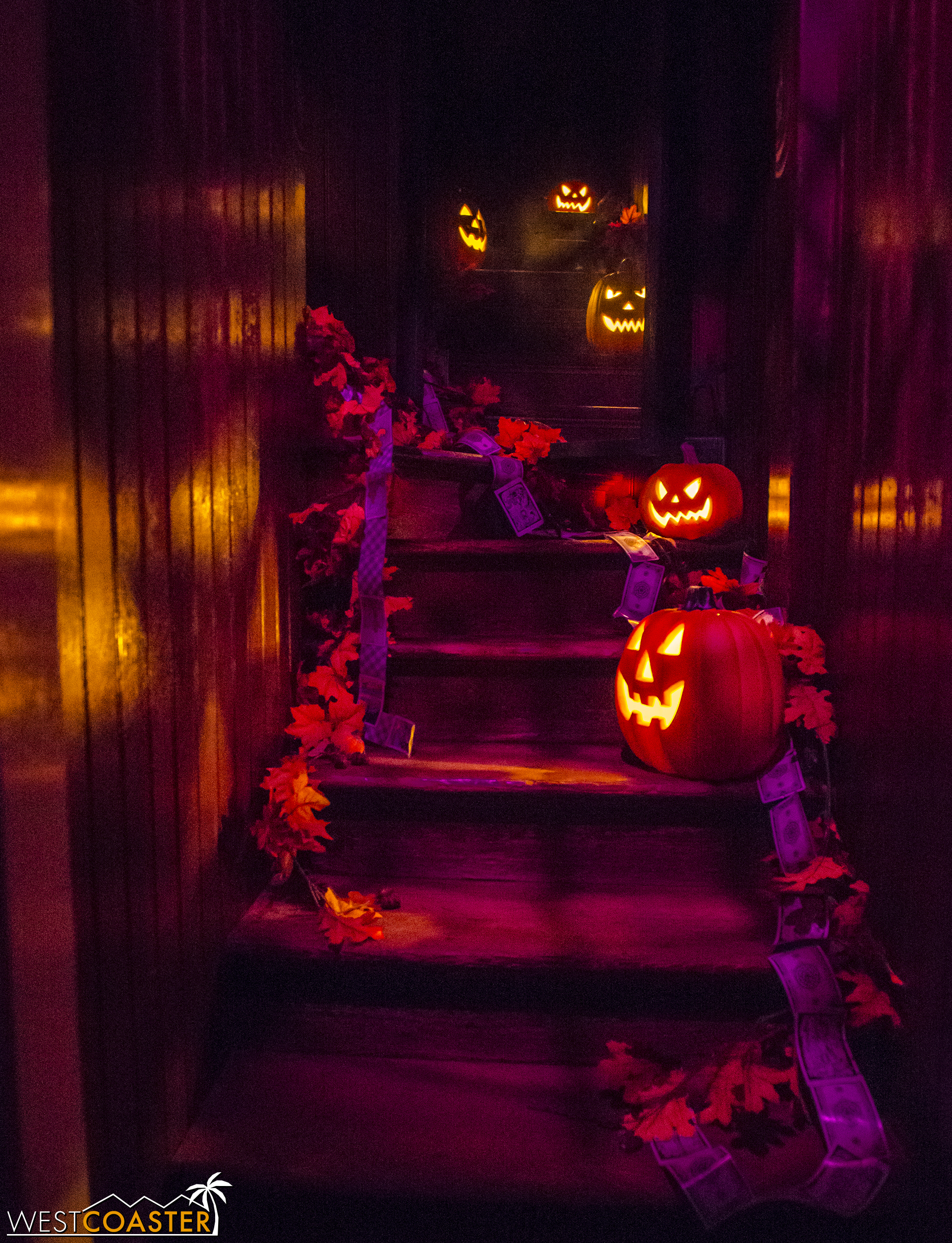 The "stairway to nowhere" glows with jack-o-lanterns at night.