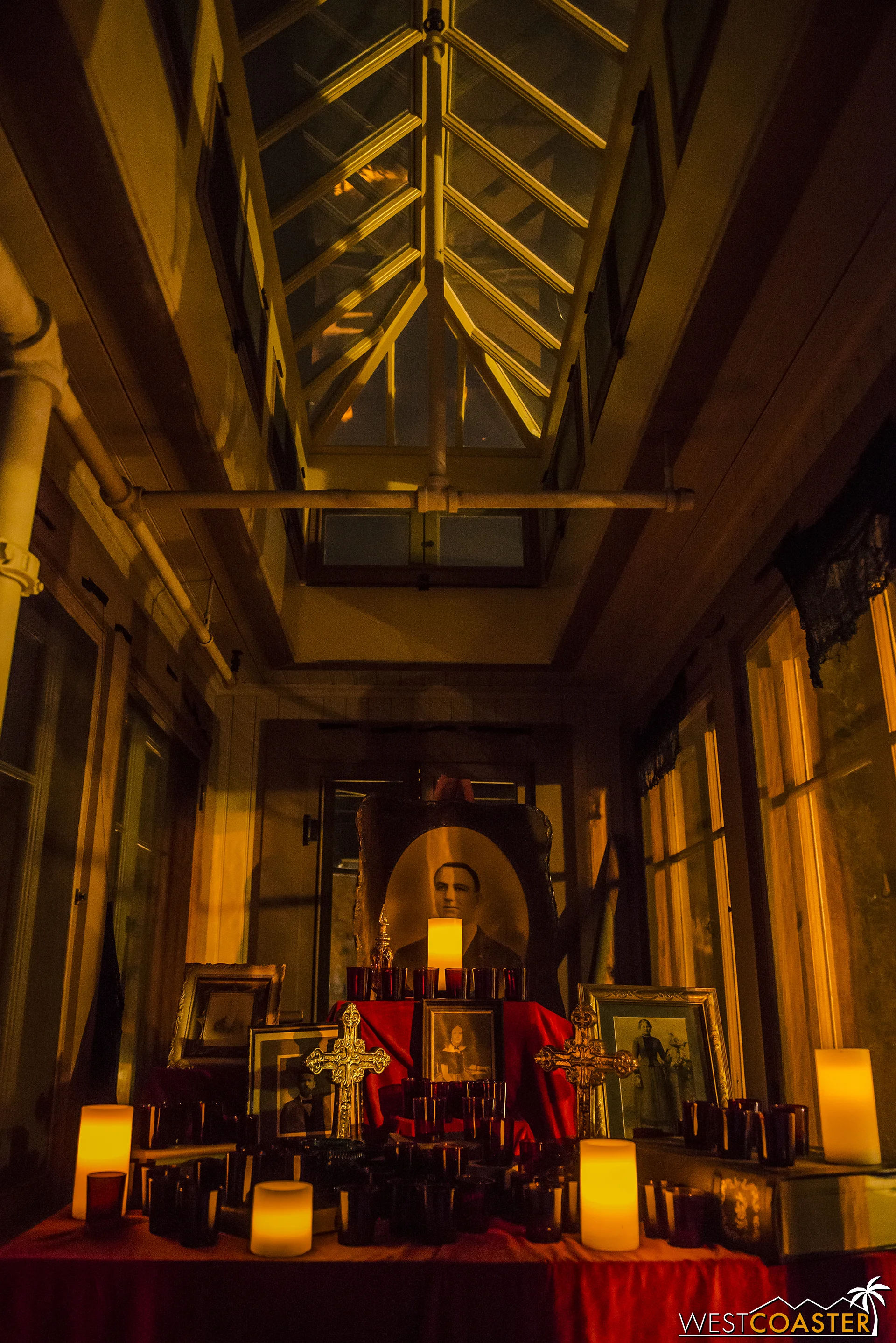 Guests pass by a shrine, but is this intended to honor a memory or cover it up?