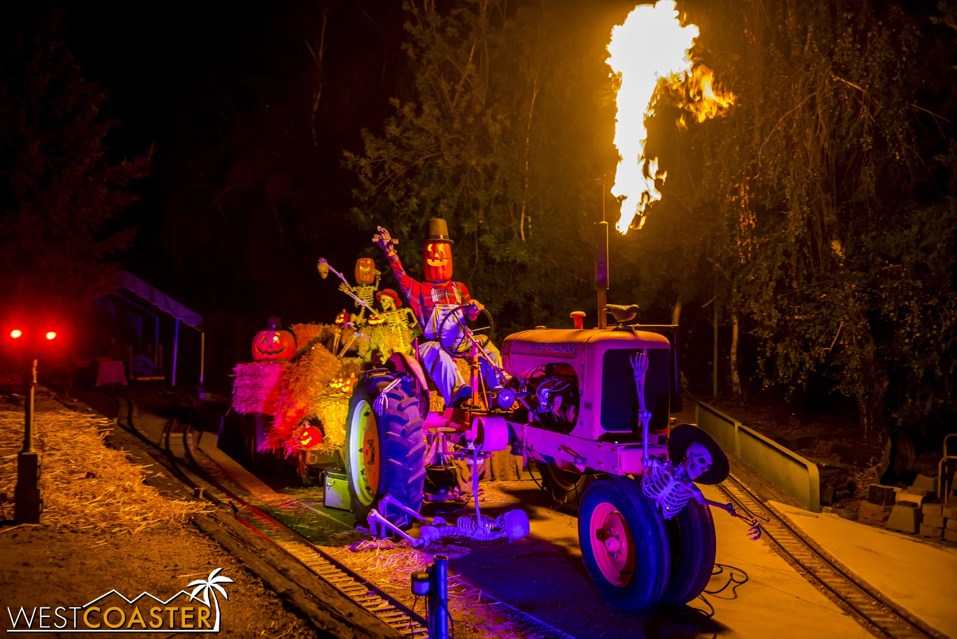 The flamethrower of this tractor is rigged to go off when a train passes by.