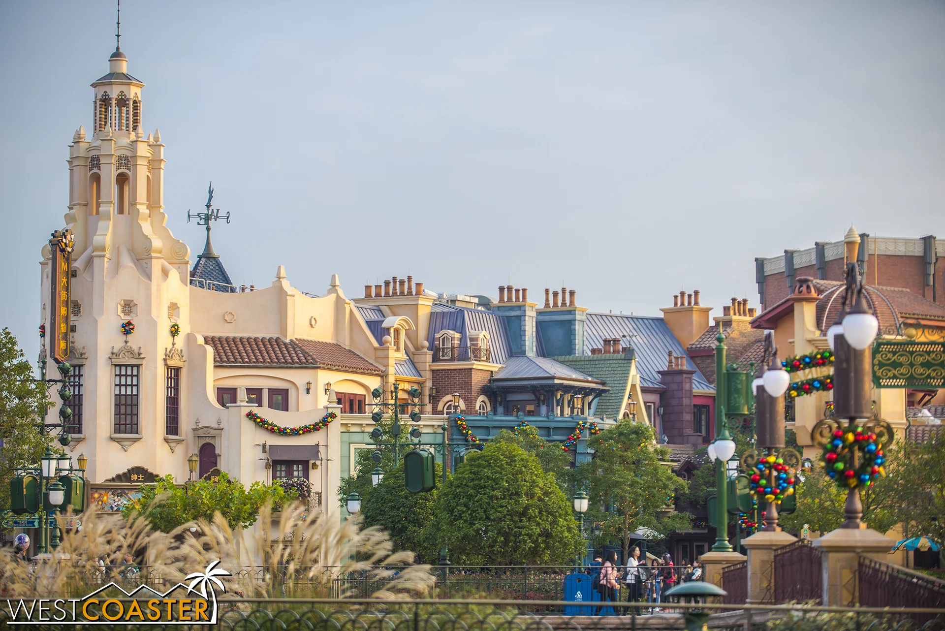 A familiar iconic tower anchors the end of Mickey Avenue, and beside it, the Walt Disney Grand Theatre.