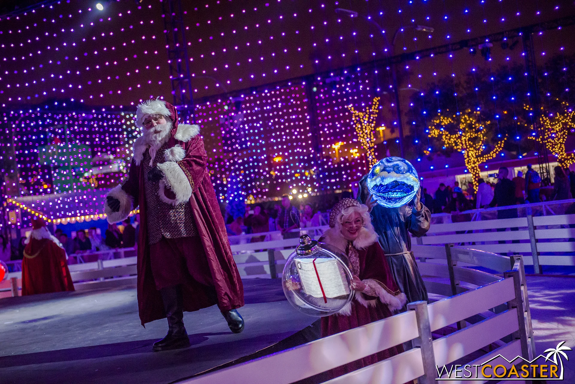 Mr. and Mrs. Claus and their international friends bring some mystical ornaments to help light the tree.