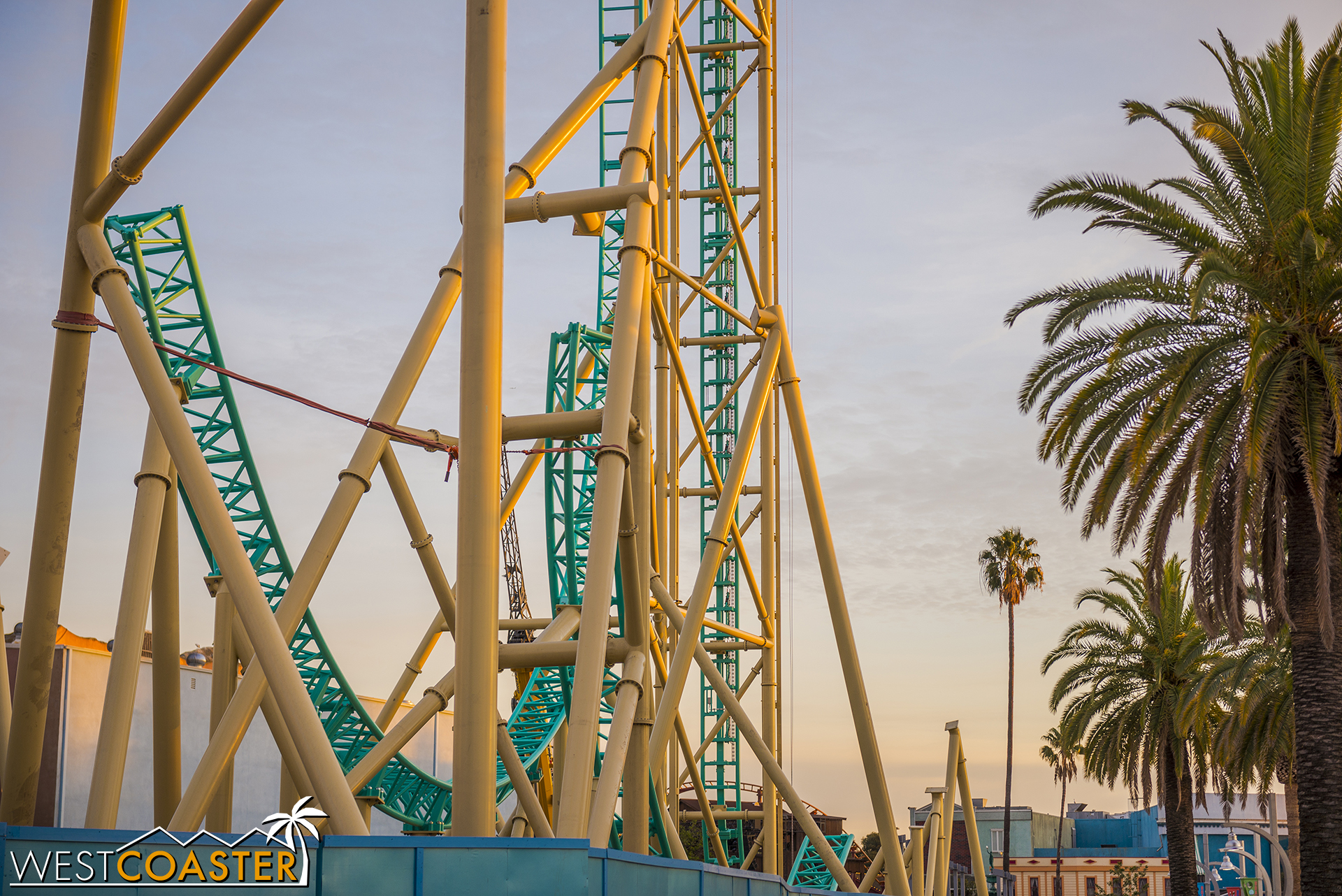  On the left is the start of the next hill after the first drop. On the right, partially obscured by the supports, is the downward half of the second inversion, an oversized corkscrew element. 