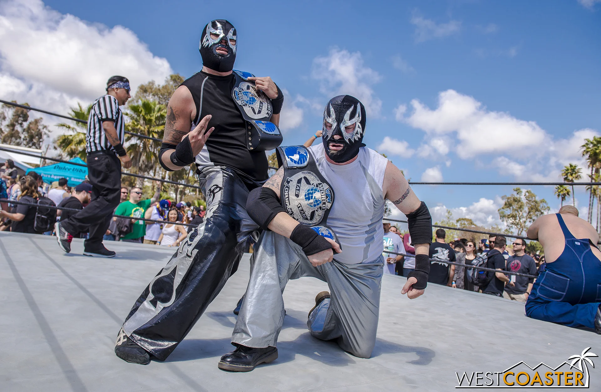 Lucha libre wrestling was in fast action. Fun fact: one of these two is actually "Evil," leader of the Queen Mary's Dark Harbor slider group.