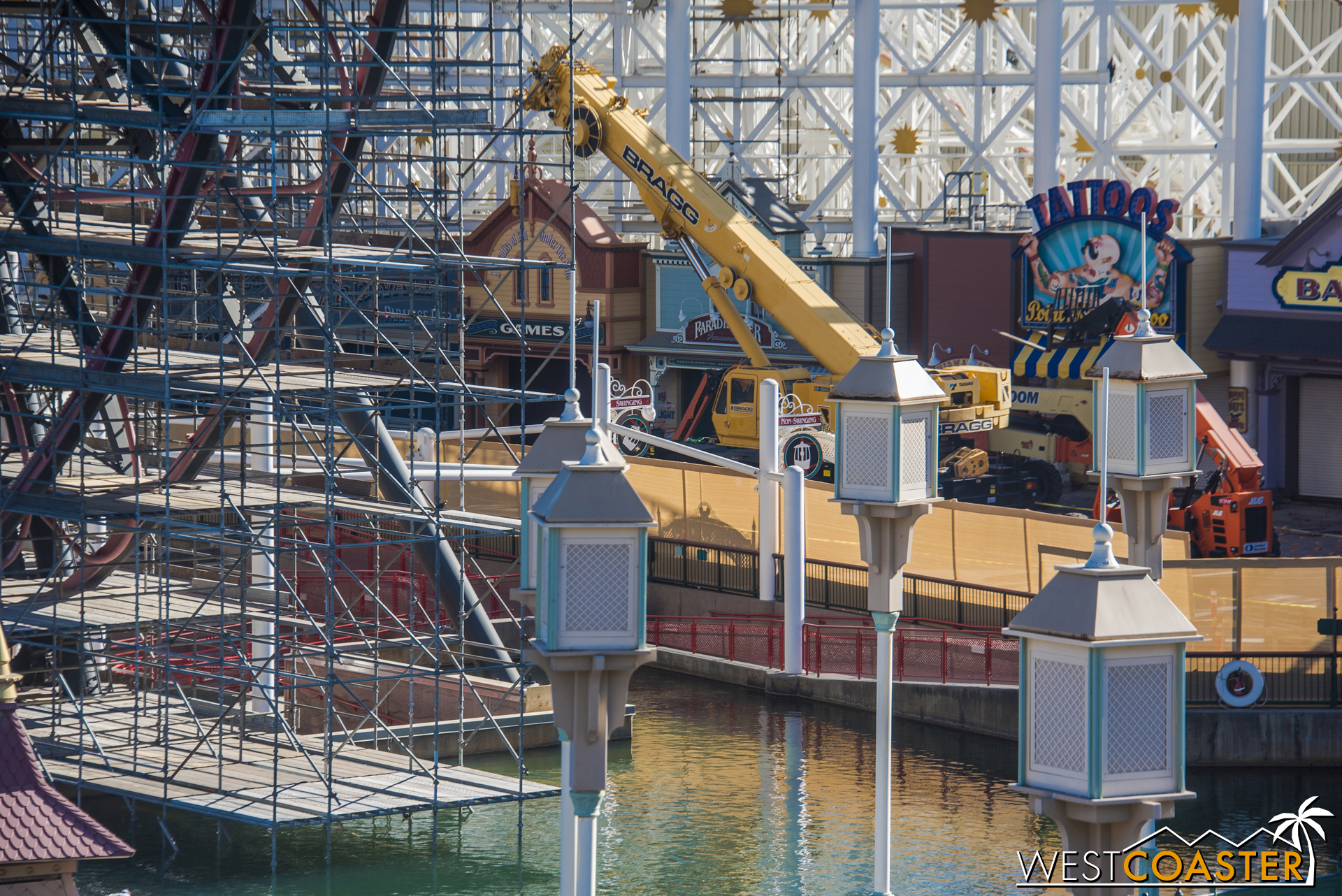  A crane has shown up over by the midway games. 