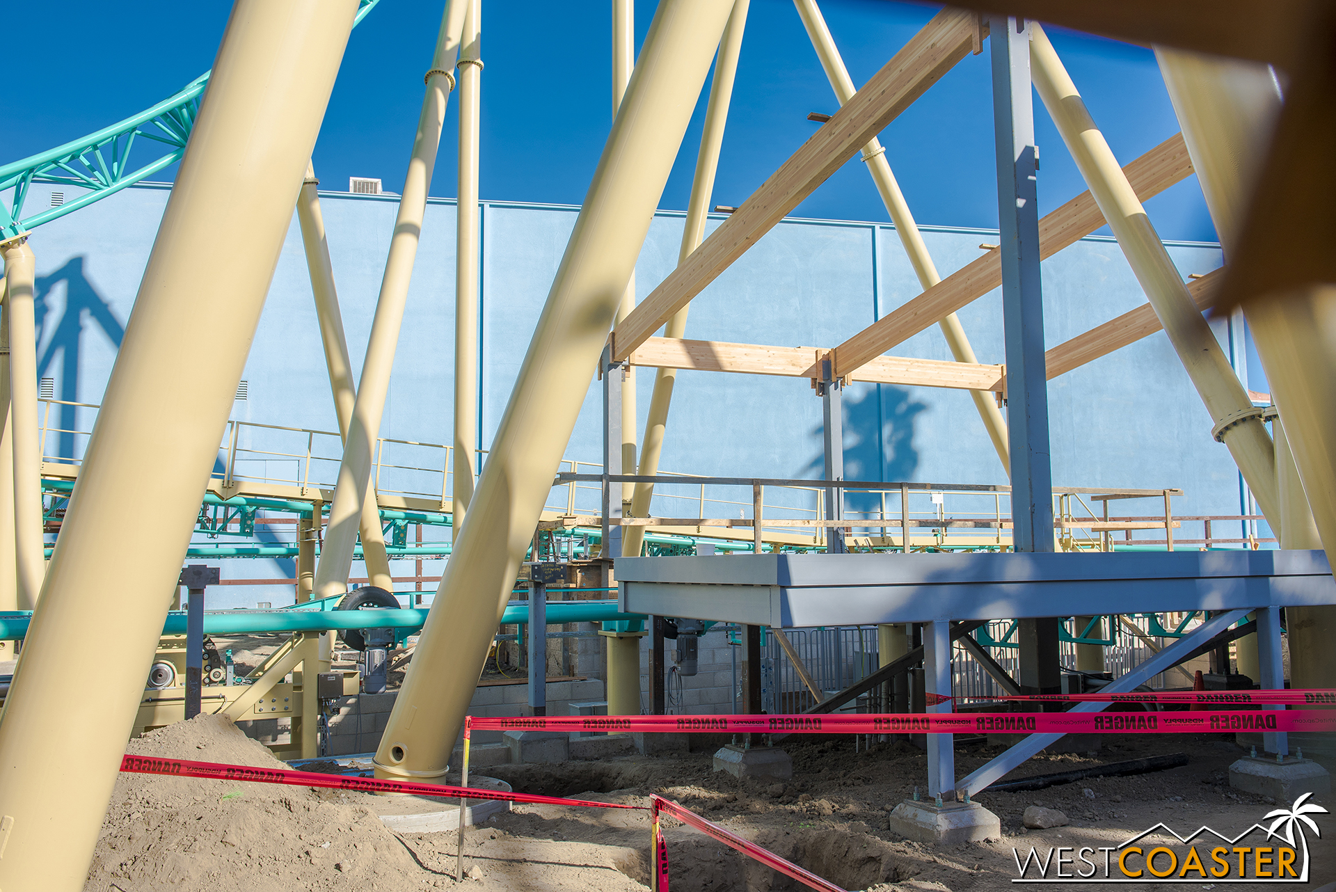  A glimpse through the work walls shows how the canopy of the station lays out to the platform and track. 