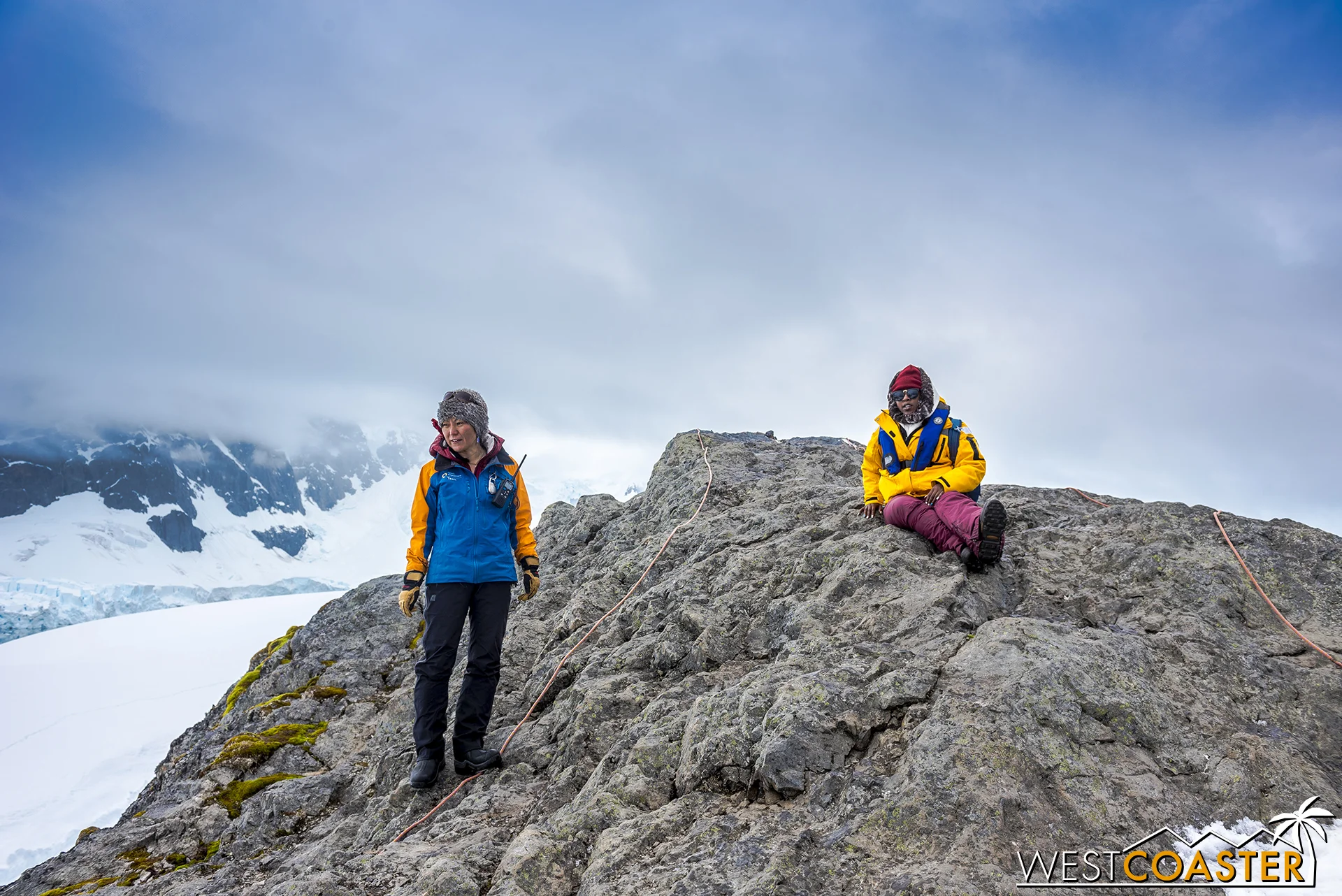 An adventurer takes in the view beside on of our Quark Expedition guides.